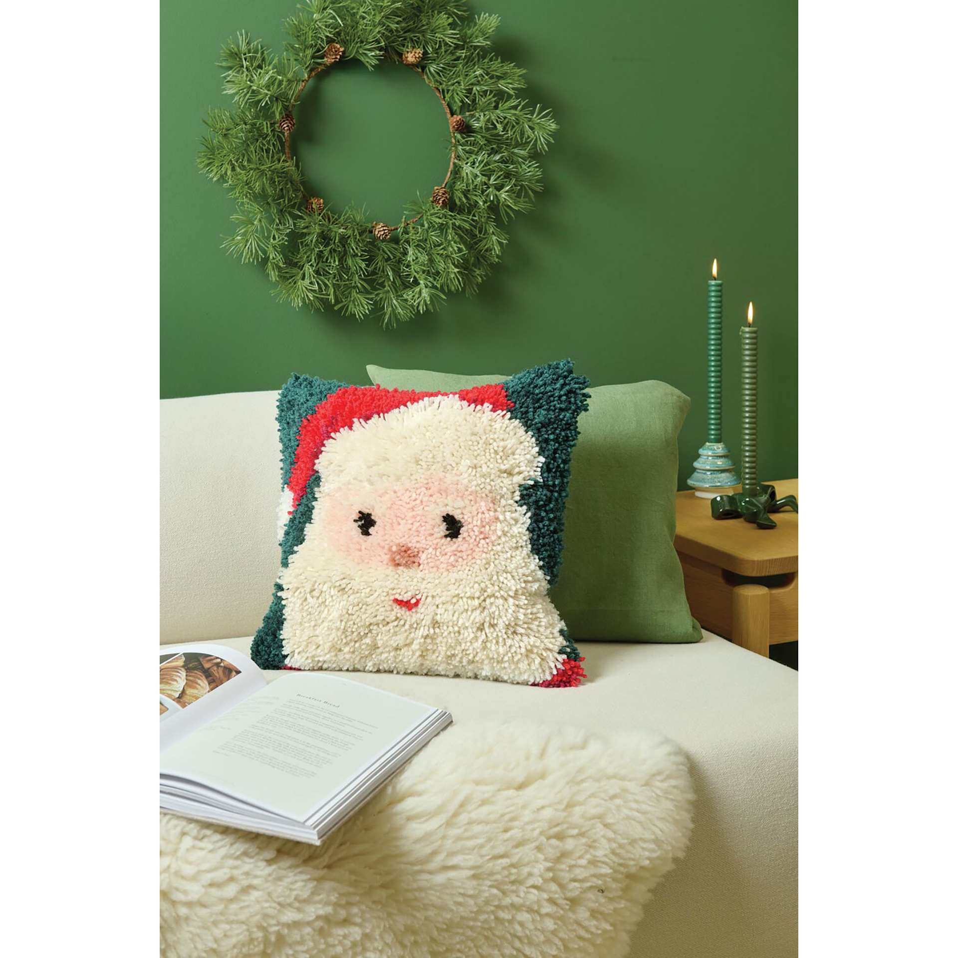 Rico Design Latch Hooking Kits - Santa Pillow, 15" x 15", finished kit on couch