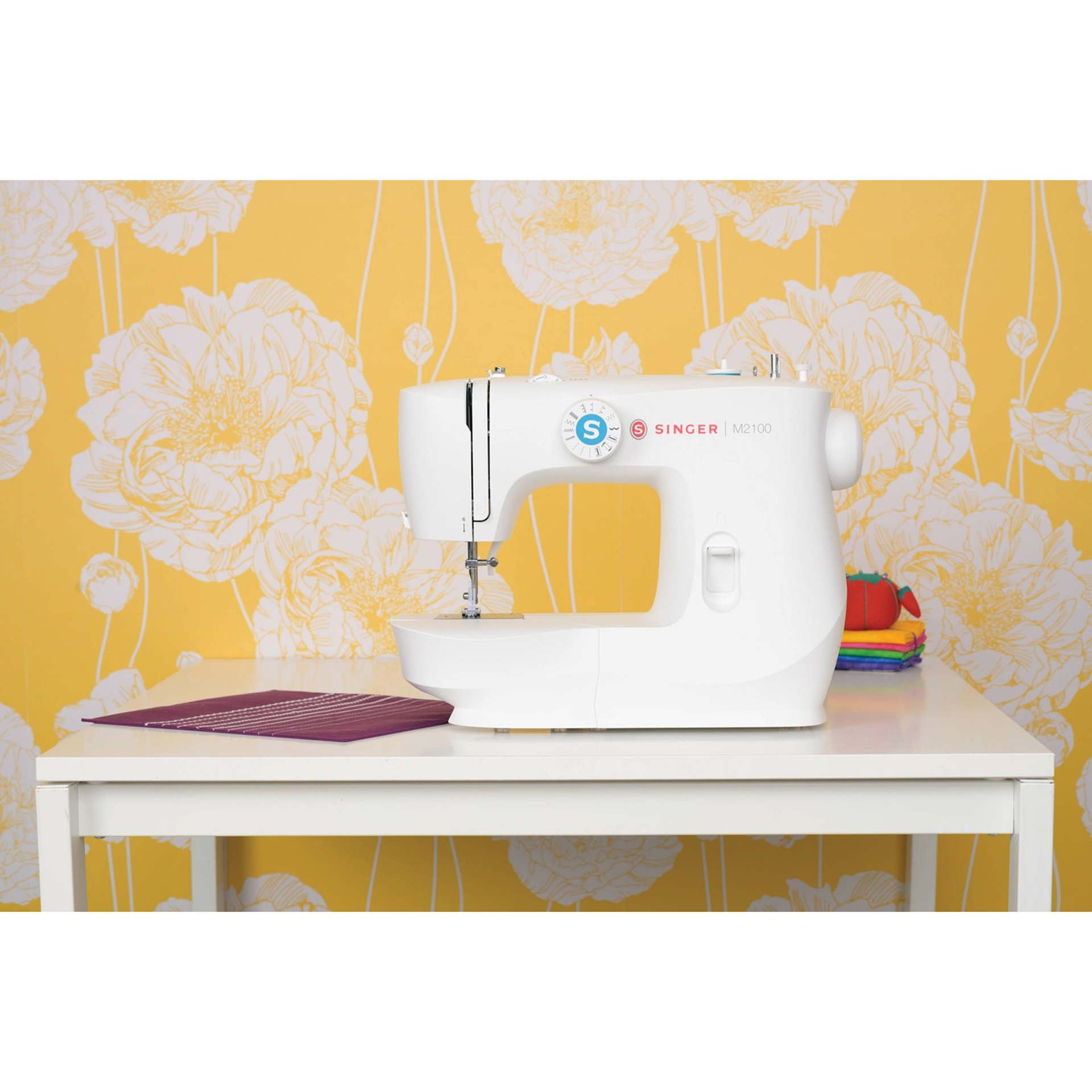 Singer M2100 Sewing Machine, on top of table