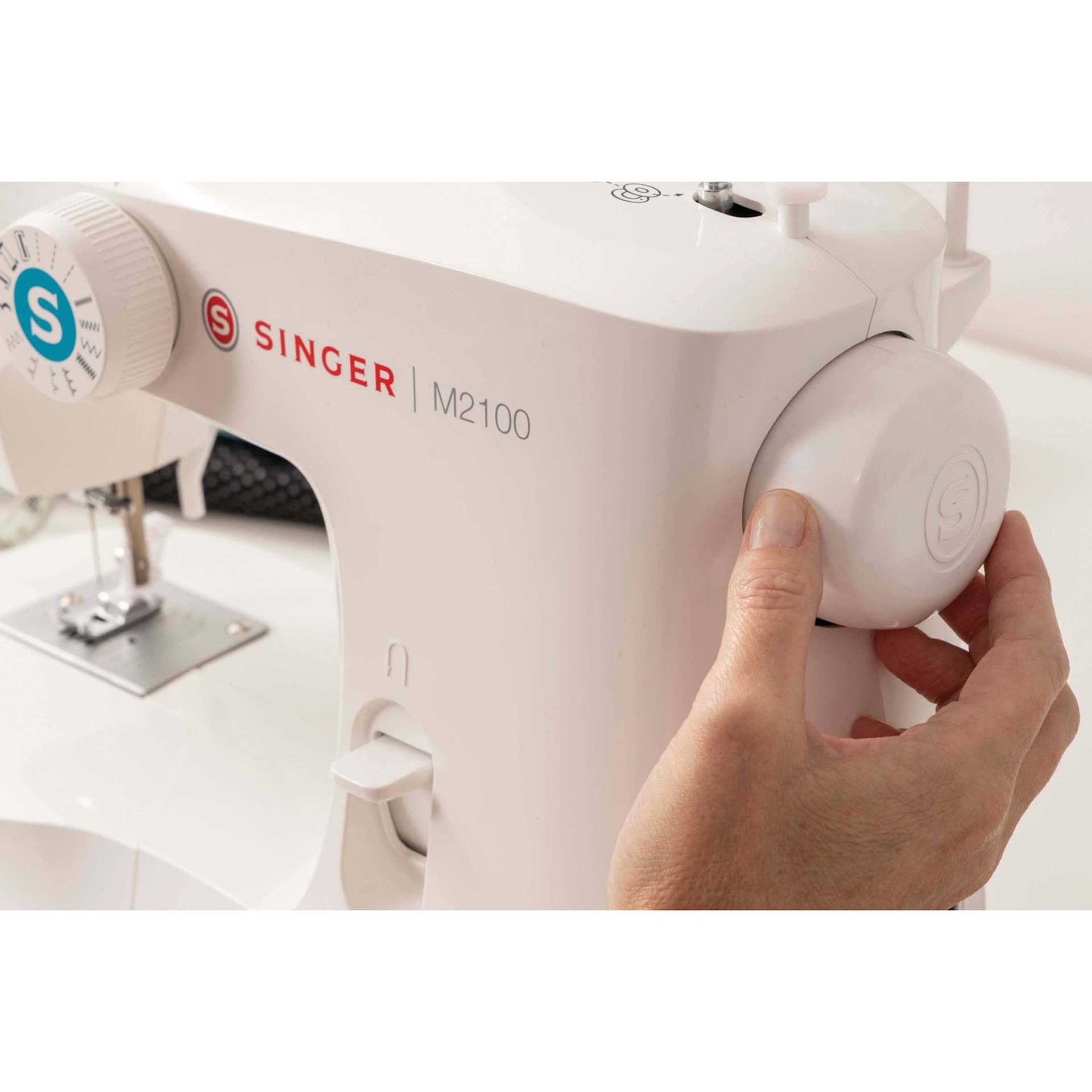 Singer M2100 Sewing Machine, close up of the hand wheel