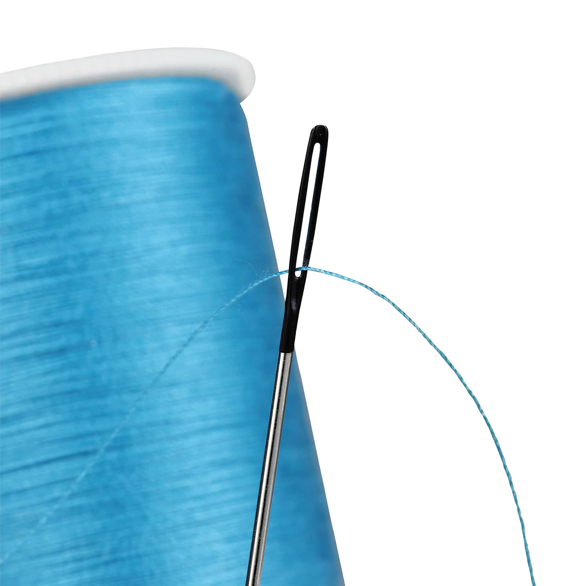 Singer Chenille Needle Set, close-up of a threaded needle