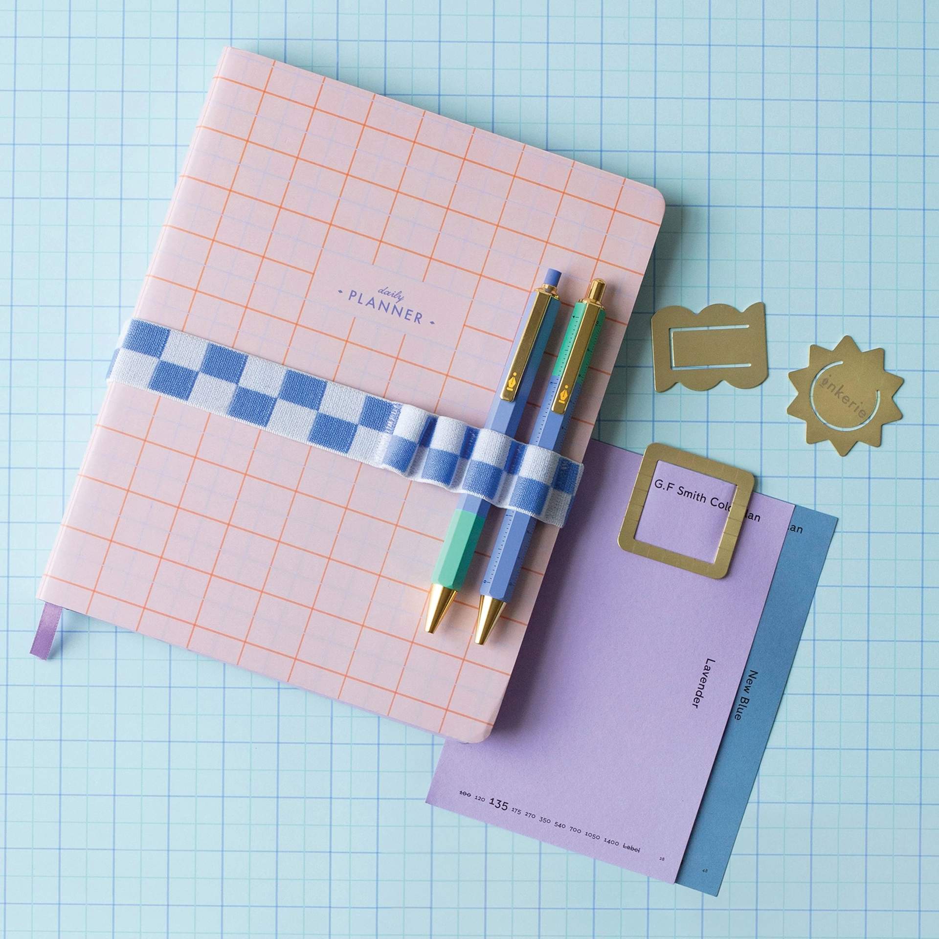 Kikkerland Inkerie Pen Holder Book Band - Blue, on notebook