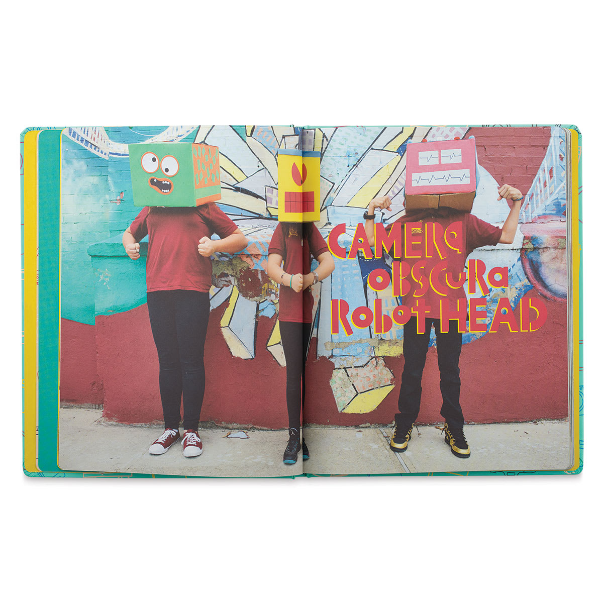 Go Photo! An Activity Book For Kids - Spread of 3 children with boxes on their heads
