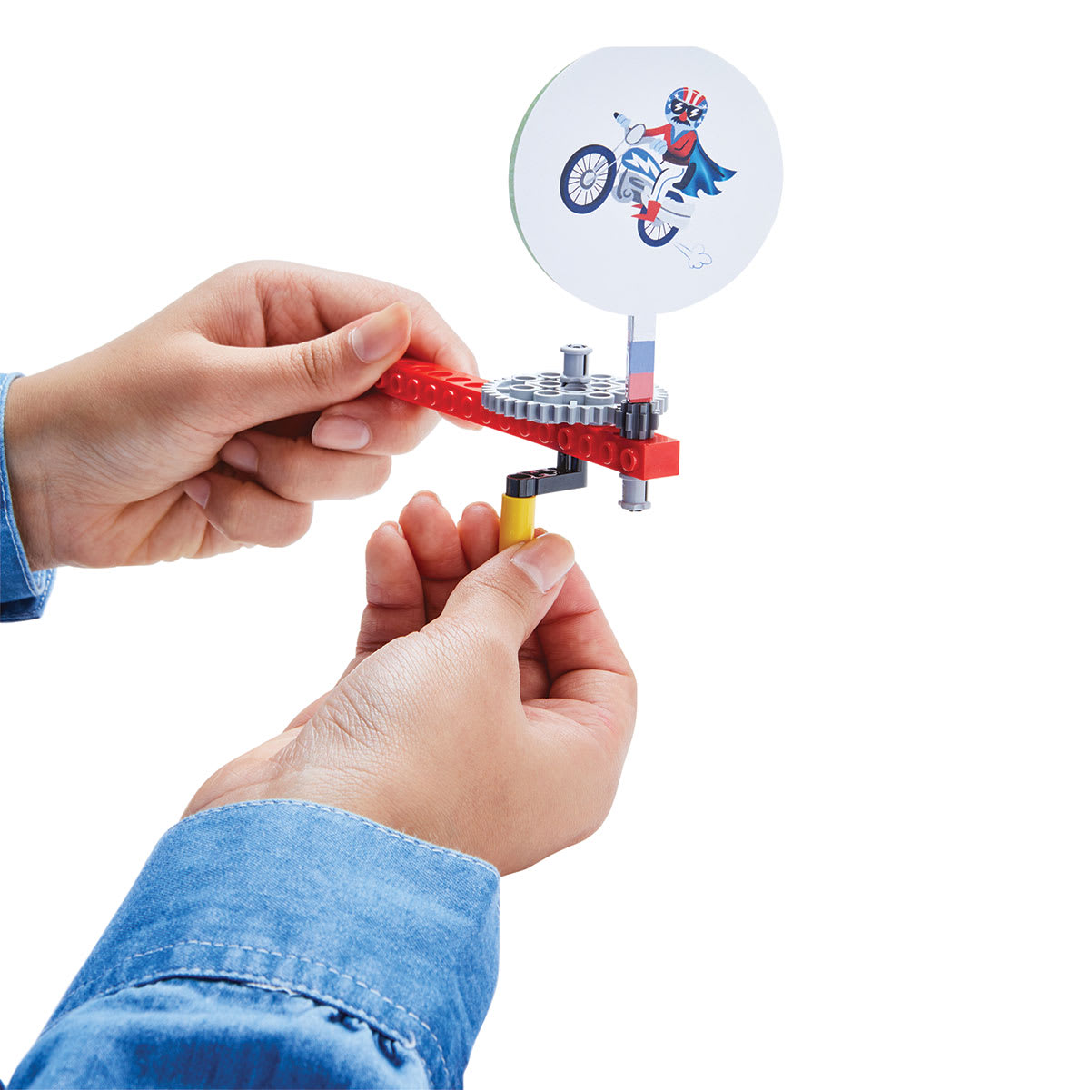 Klutz LEGO Gadgets - Finished Spin-O-Vision toy shown being turned by child