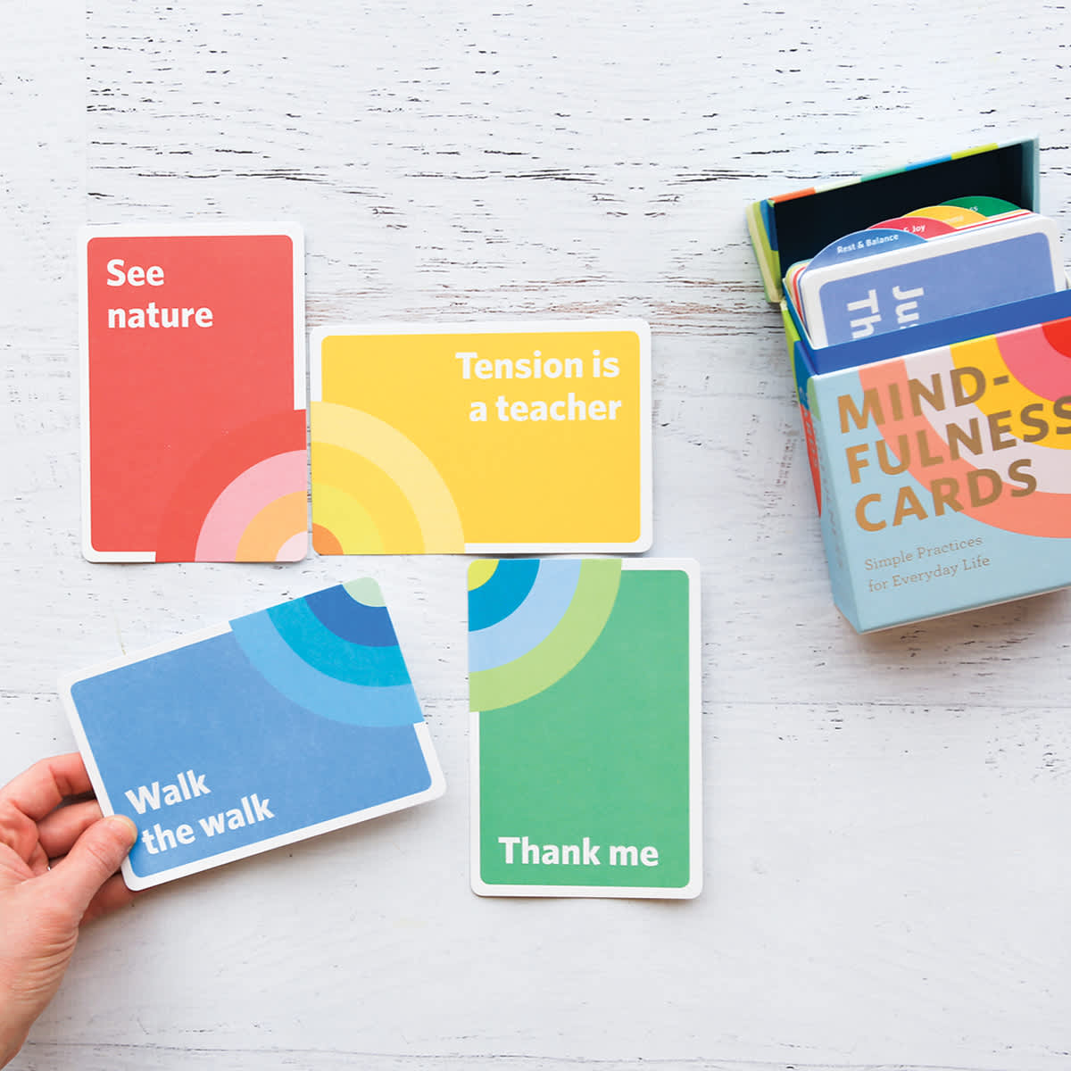 Mindfulness Cards - Hand fitting two cards with two others next to package