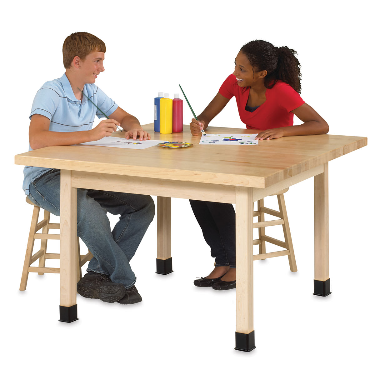 Diversified Spaces Four-Student Tables - Two seated students painting at Maple top Table