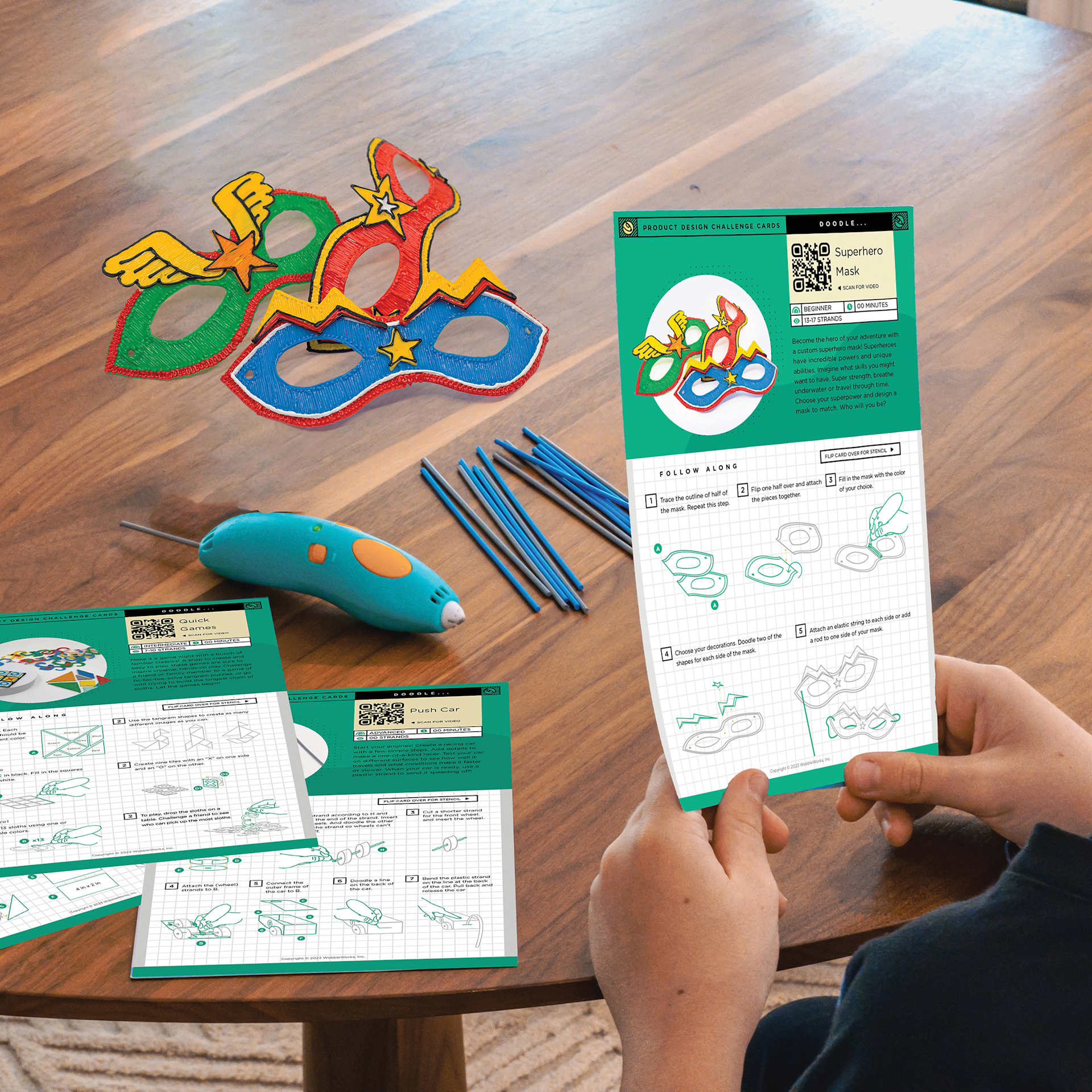 3Doodler Start+ Accessory Kit, person using a challenge card to make masks