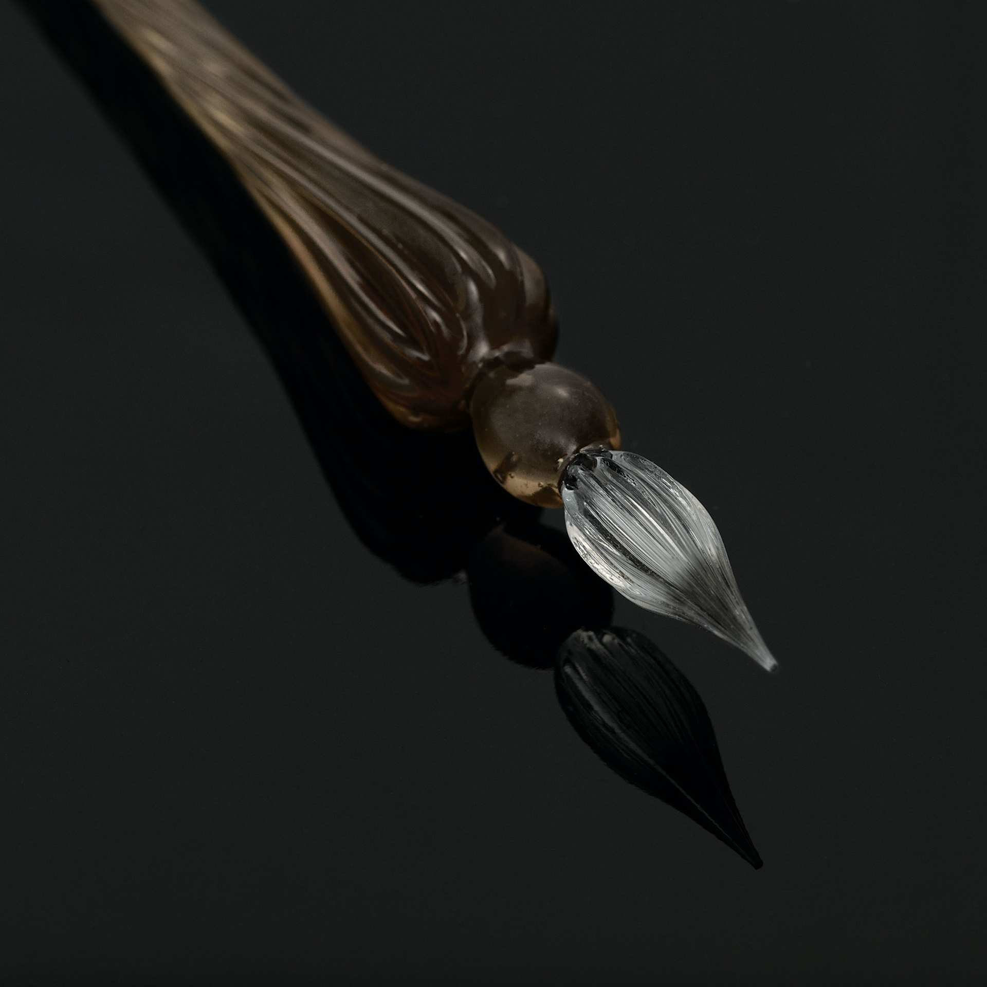 Herbin Round Glass Dip Pen - Black close-up of nib against black background