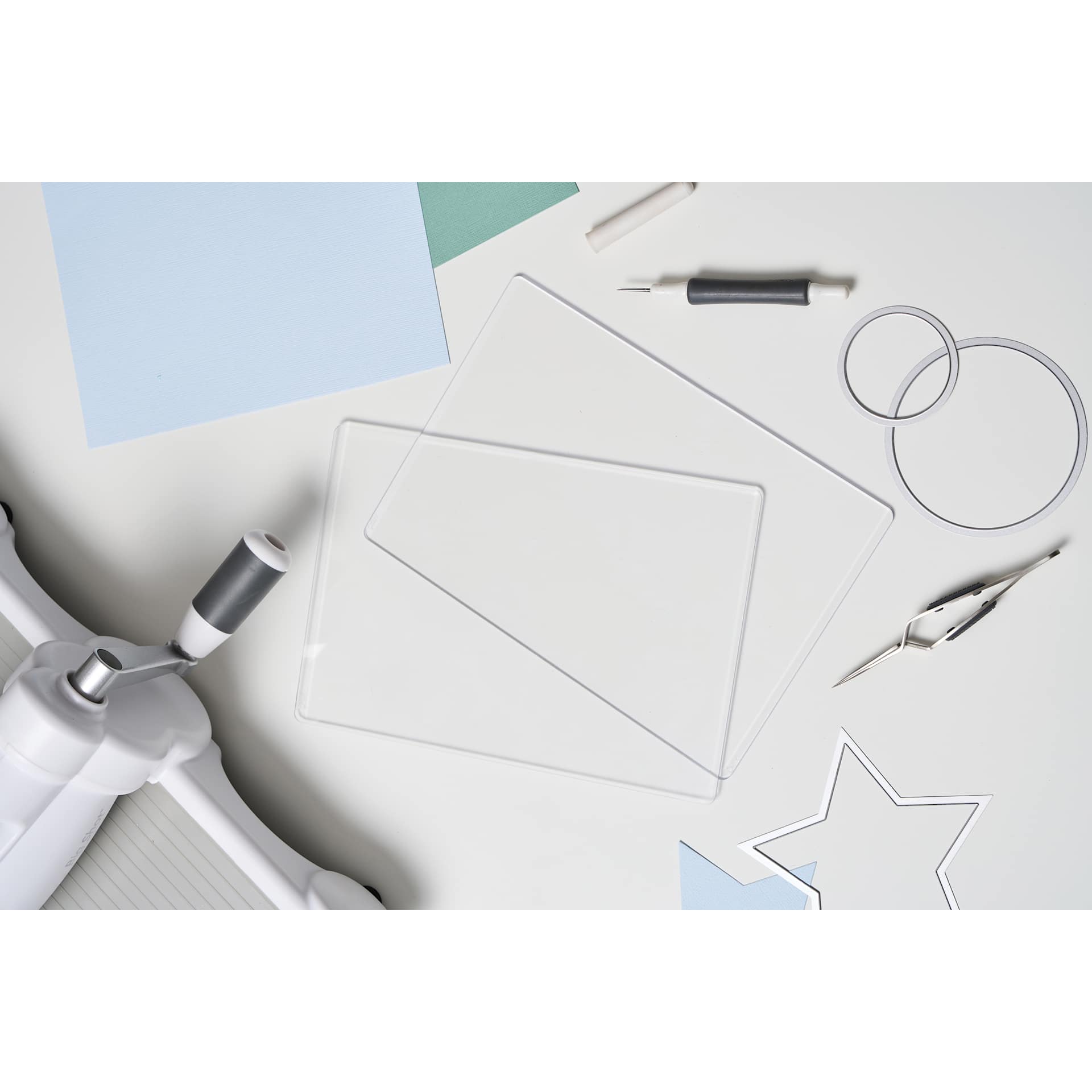 Sizzix Cutting Pads - Accessory A5, 6-1/8" x 10-1/4" x 1/8" laying on table with other tools (only single cutting board included)
