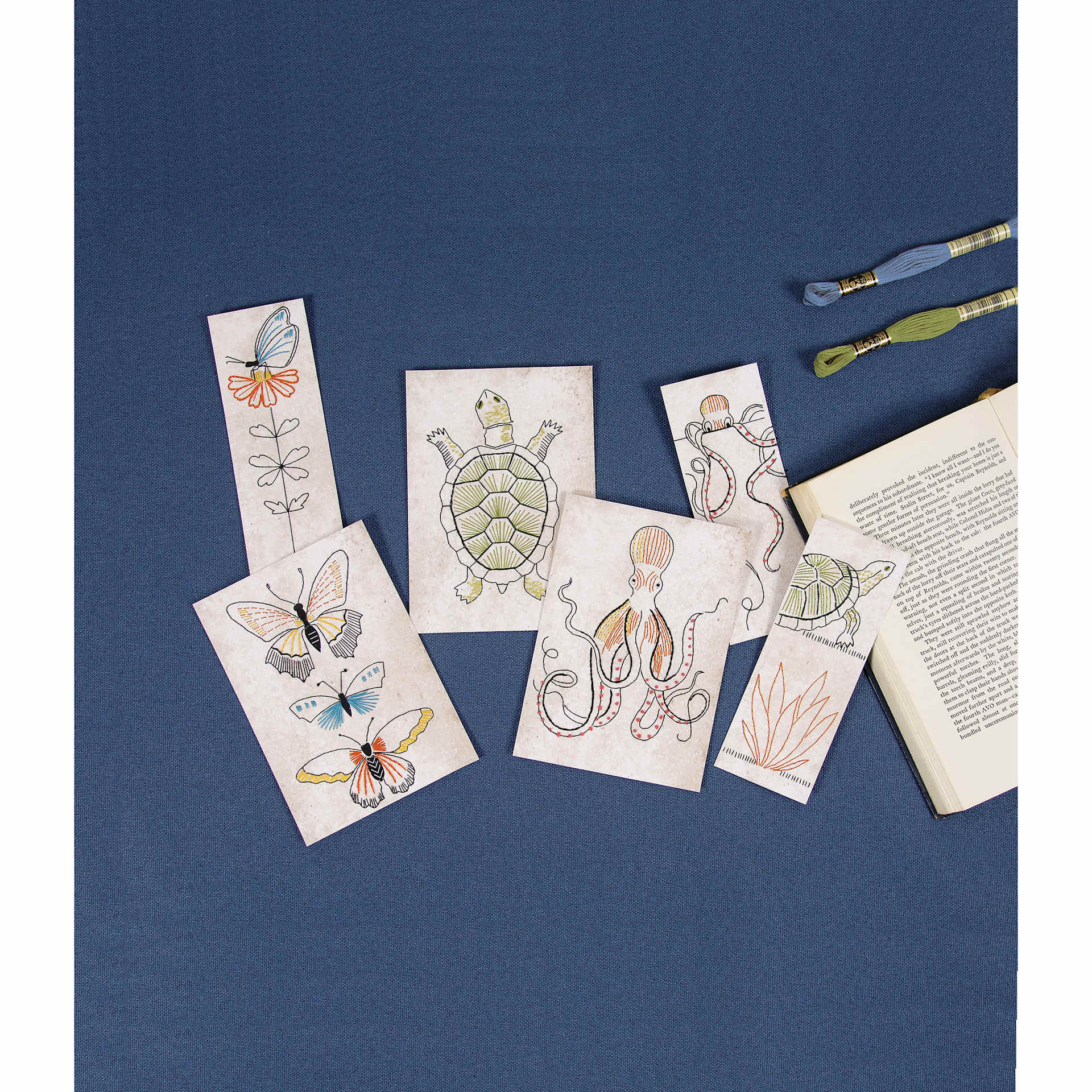 DMC Embroidery Card Kit - Animals completed projects laying on table