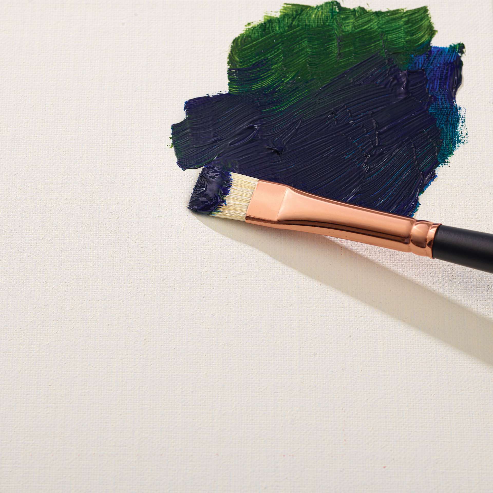 Blick Premier Oil-Primed Linen Panel with paint and a brush
