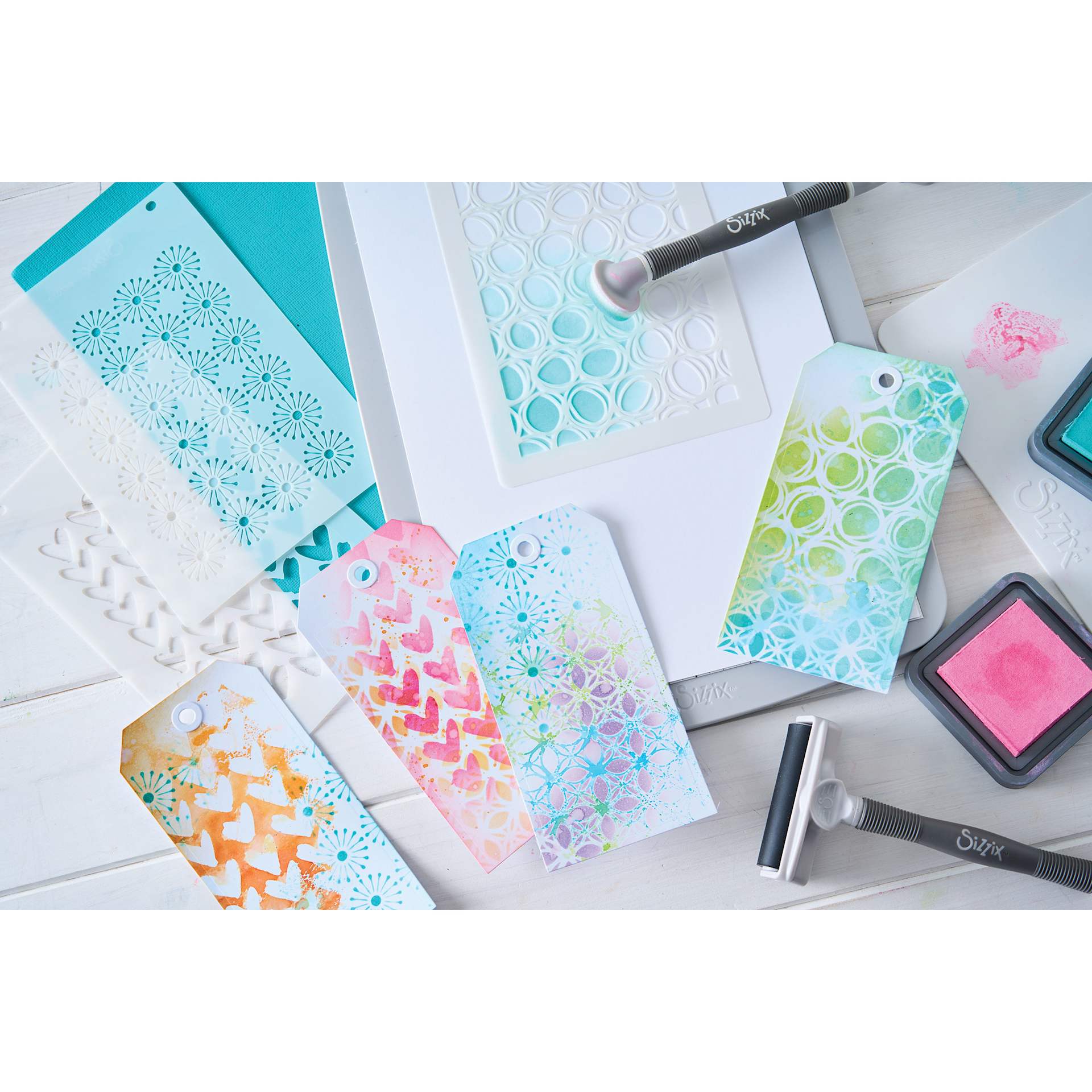 Sizzix Buildables Backgrounds Stencil Set - Set of 4, 6-3/4" x 10" showing completed projects