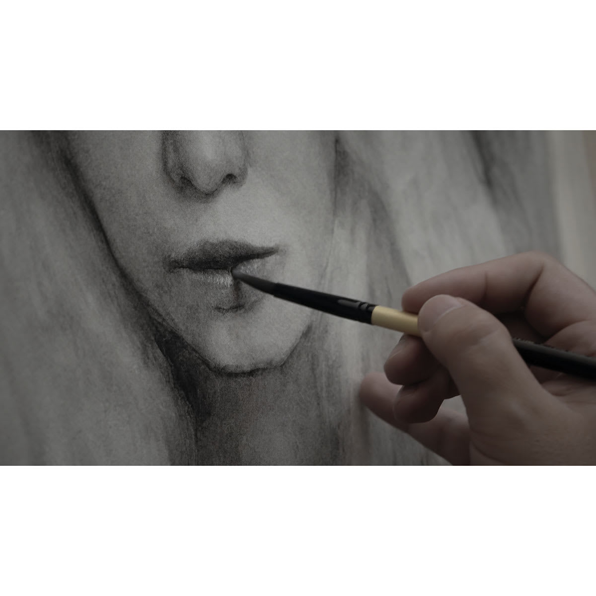 Nitram Fusain Aquarelle Charcoal Watercolor being used to paint a female face.