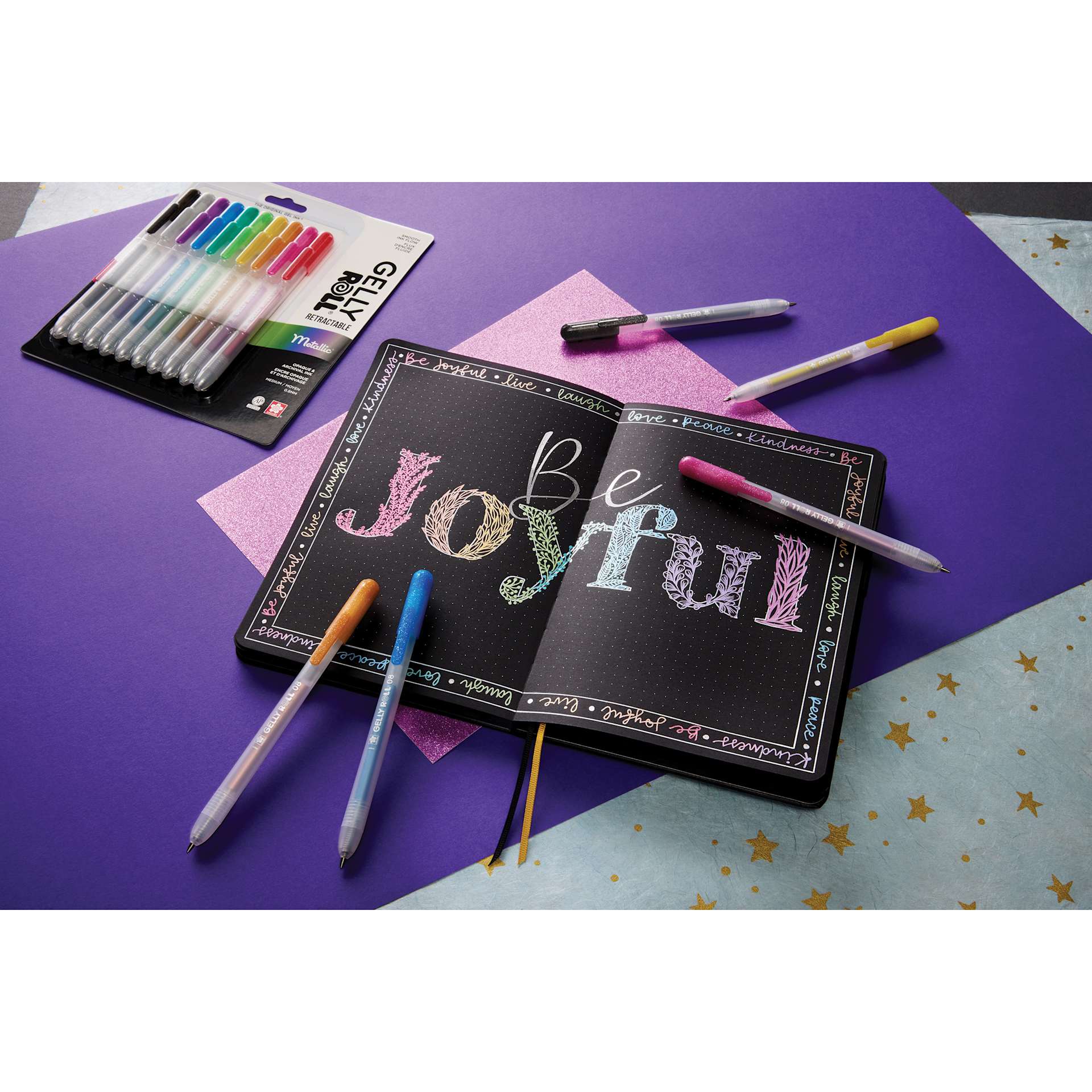 Sakura Gelly Roll Retractable Metallic Pens - Assorted, Medium Tip, Set of 10, contents, sealed set, and other supplies on table (not included)