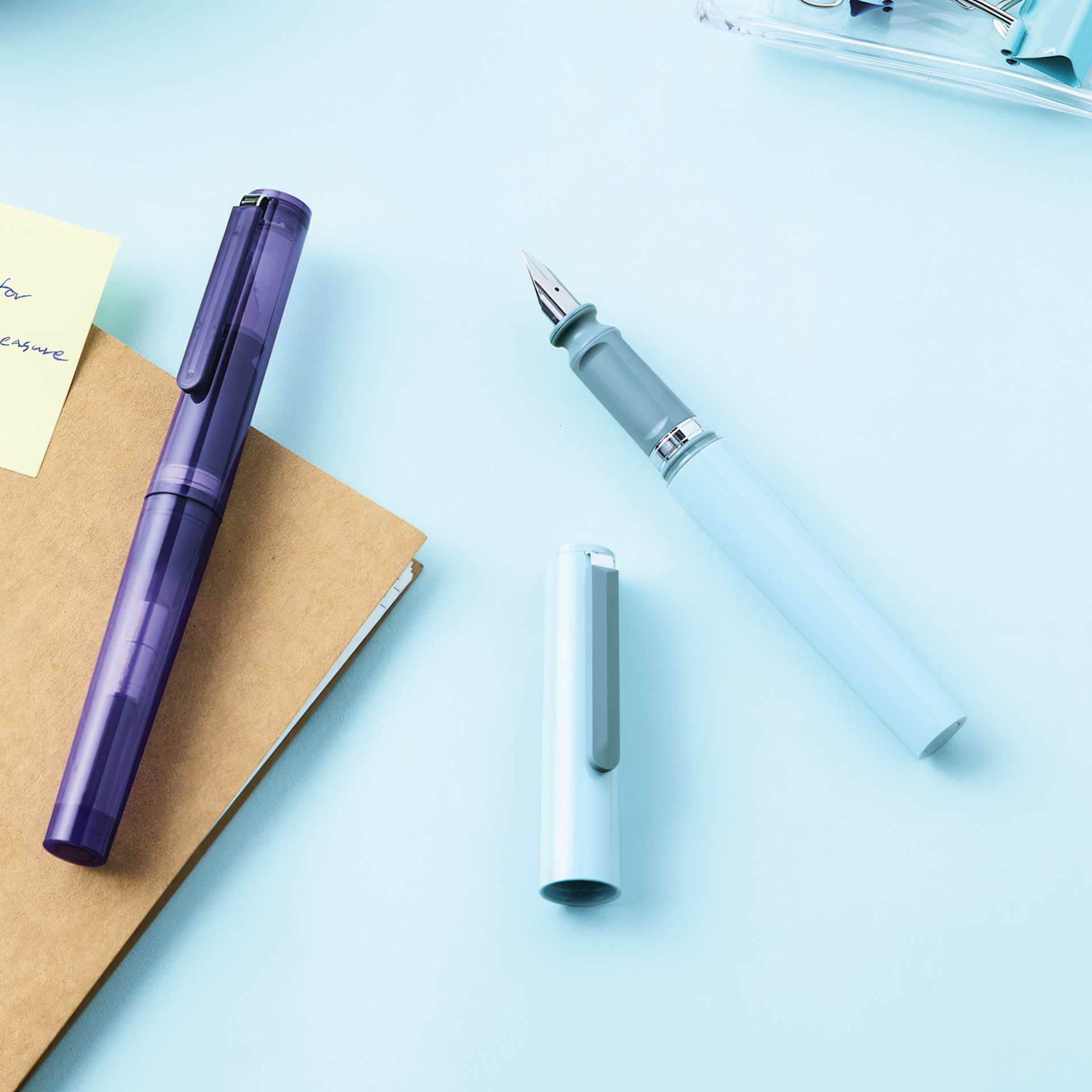 Sailor TUZU Adjust Fountain Pen - Light Blue and Transparent Violet laid out
