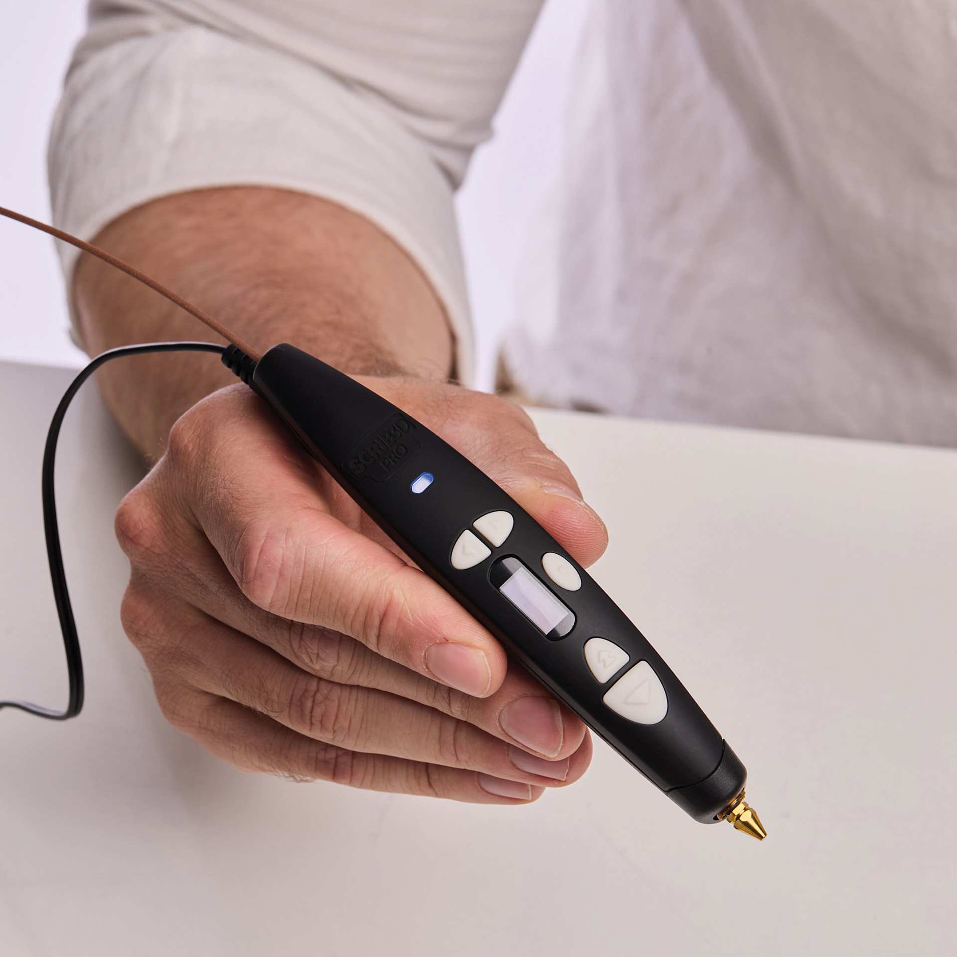 Scrib3D Pro 3D Printing Pen Set, pen in a hand