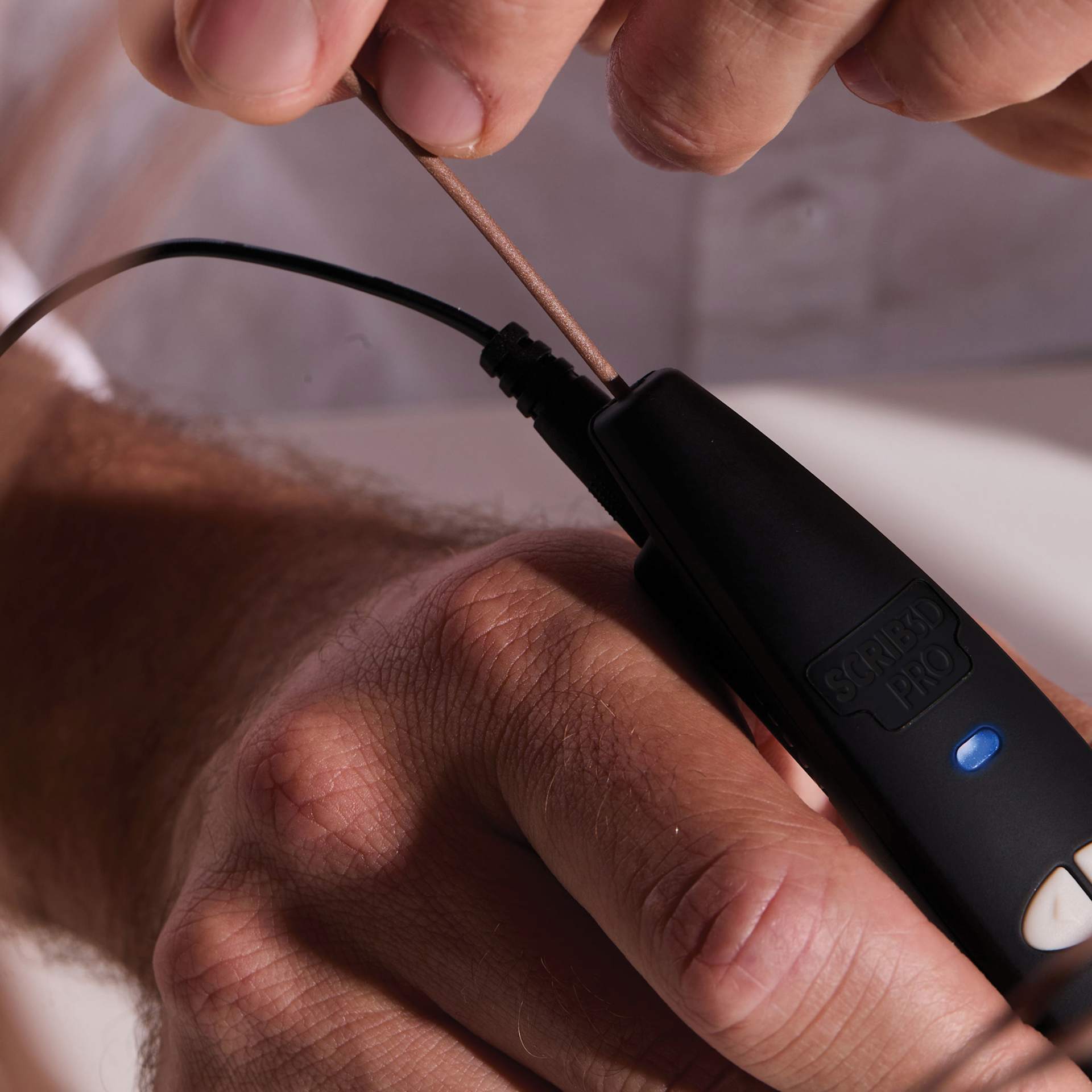Scrib3D Pro 3D Printing Pen Set, close up of filament and pen