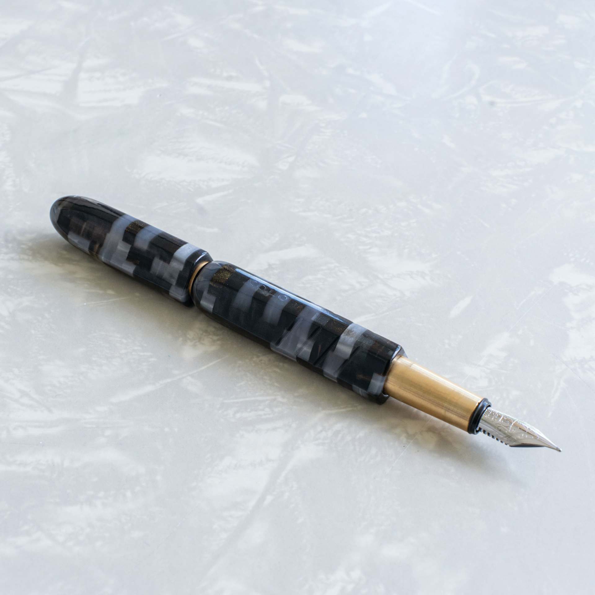 Kolo Tino Acrylic Fountain Pen - Ashen, Limited Edition, on table