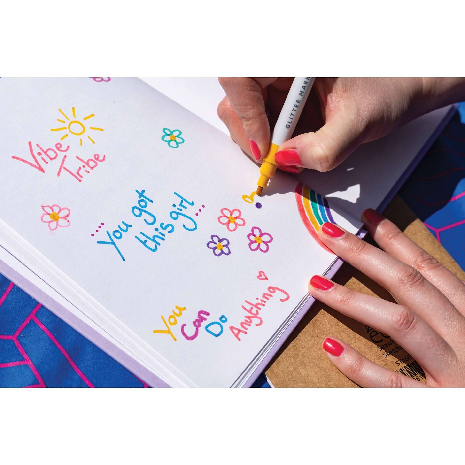 Colorista Glitter Markers - Sparkling Brights, single marker in hand writing a message on paper