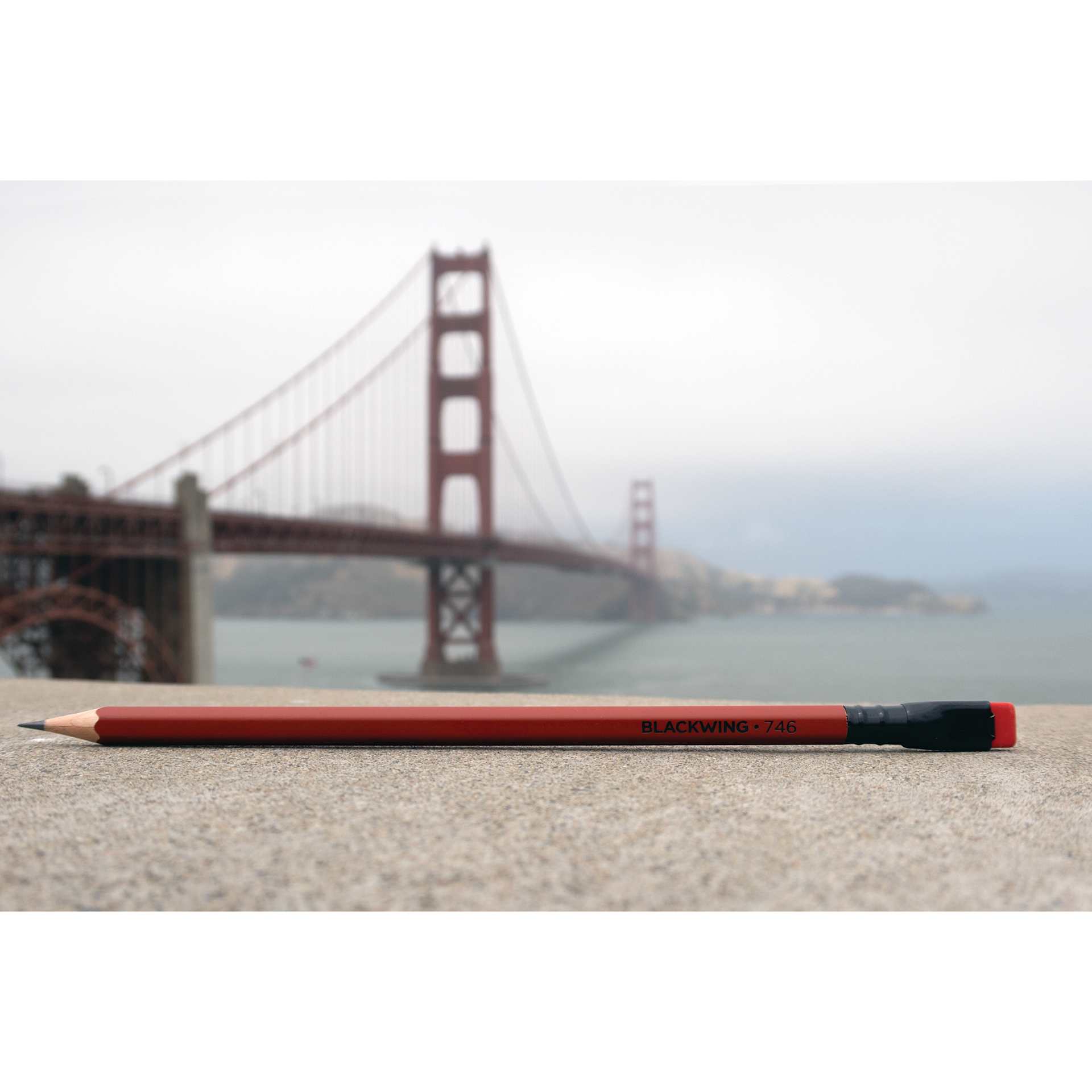 Blackwing Volumes 746 The Golden Gate Bridge Pencil, laid out with bridge in the background