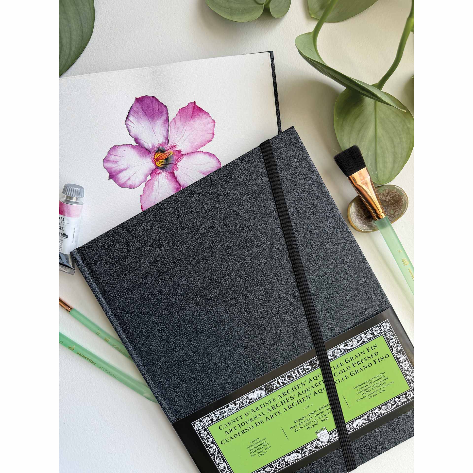 Arches Hardbound Watercolor Art Journal - 8.3" x 11", Cold Press, on talbetop with flower artwork