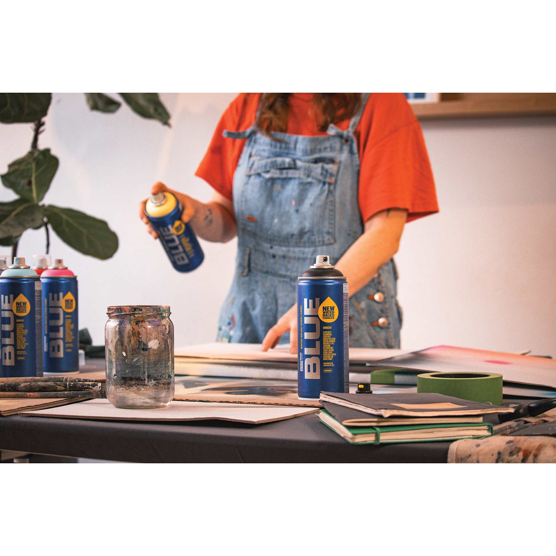 Montana Blue Water-Based Spray Paint in-use in an art studio