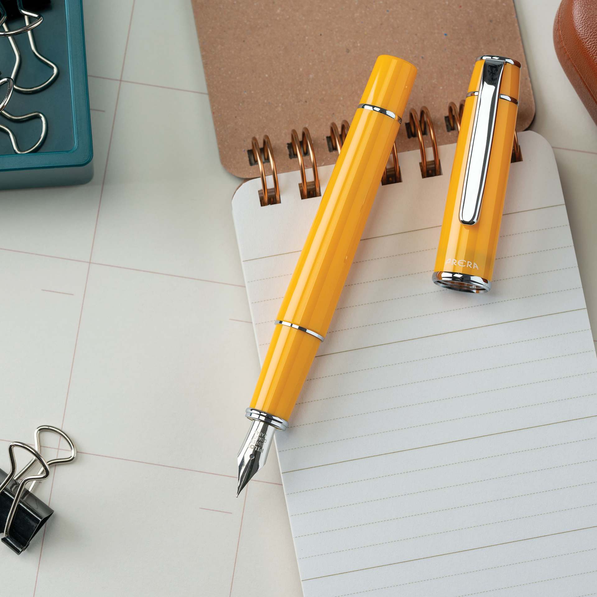 Pilot Prera Standard Fountain Pen - Honey Yellow, Fine, cap off with notepad (not included)
