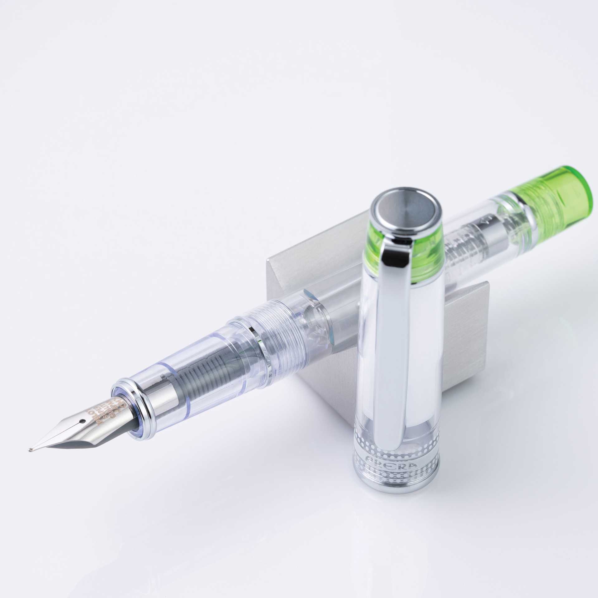 Pilot Prera Clear Fountain Pen - Light Green, Medium Nib, on stand (image may depict a different style nib)