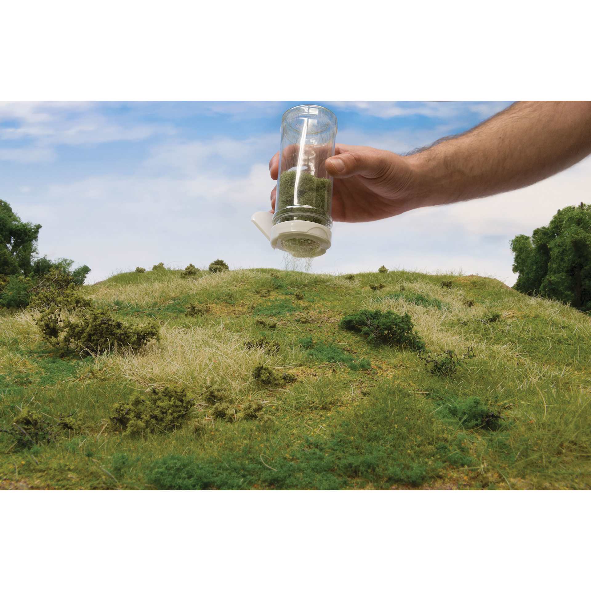 All Game Terrain Static Grass Shaker Kit, grass being shaken onto terrain
