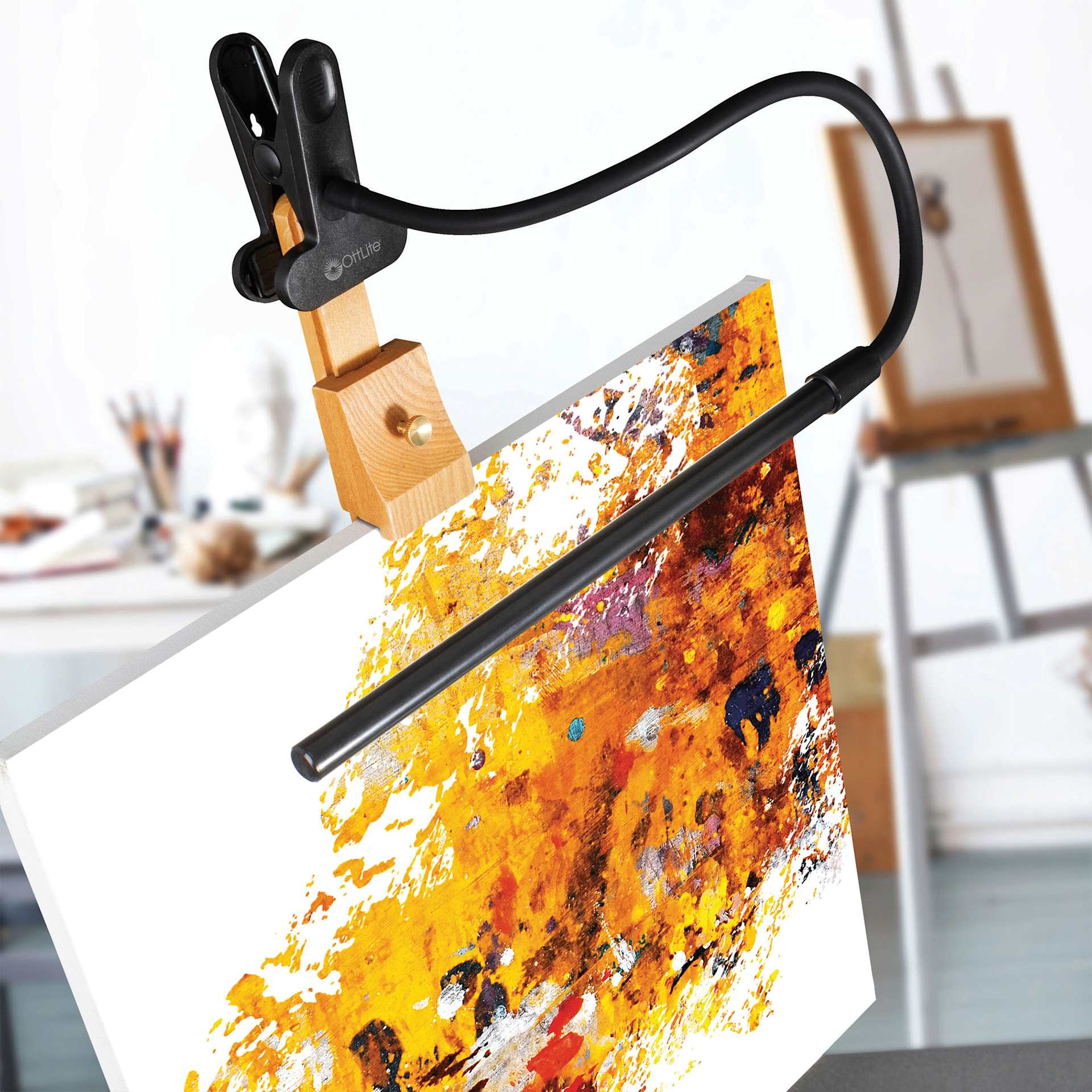 OttLite Clip-On LED Easel Lamp - Black, attached to an easel