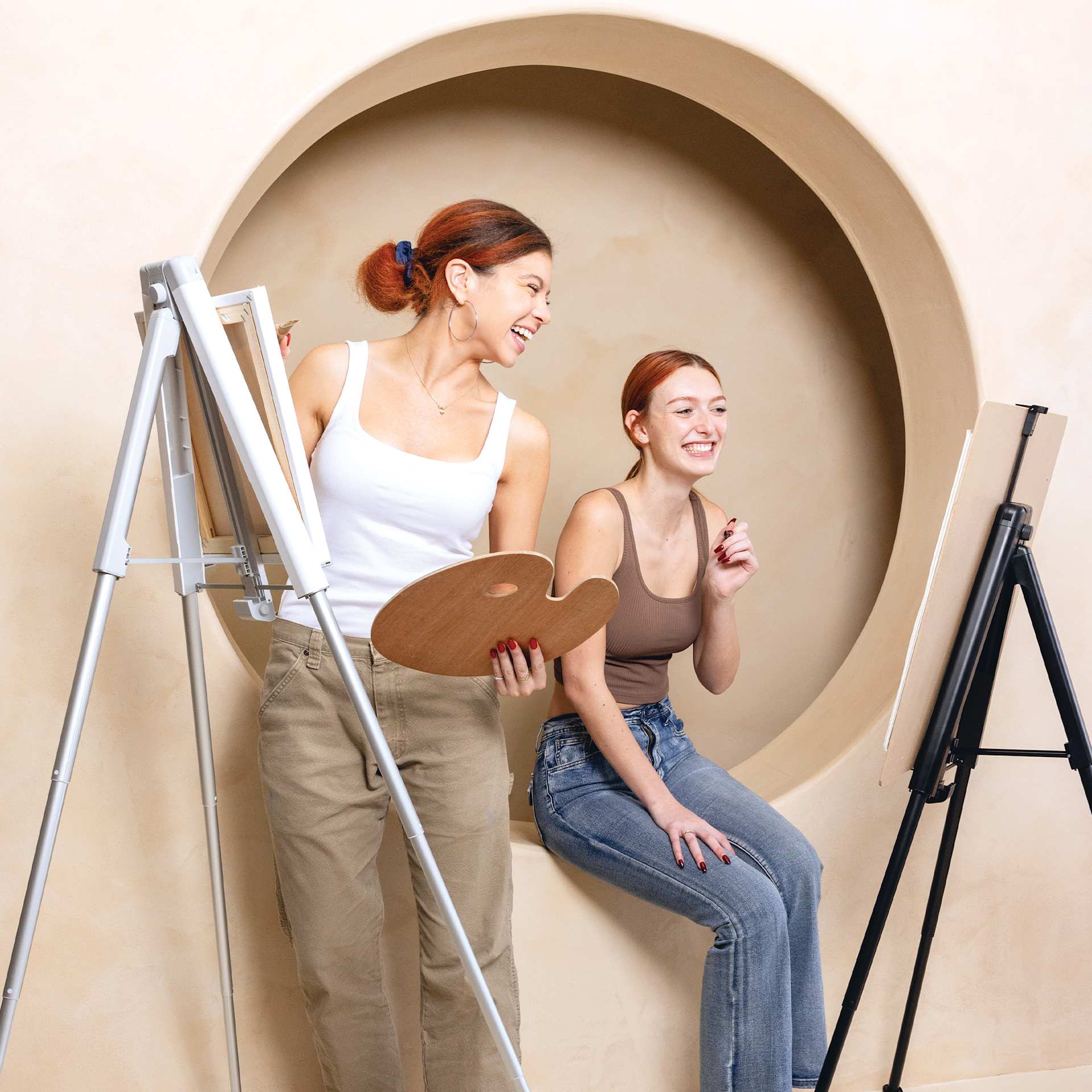 KraftGeek Easels - two artists painting on white and black easles