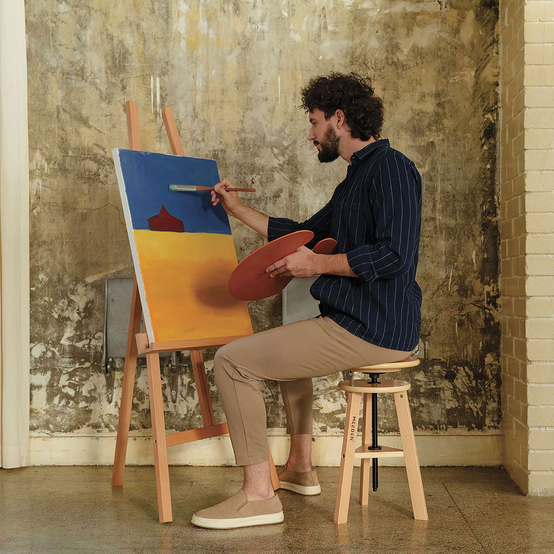 Meeden Adjustable Drafting Stool - 19" - 26" H, 12" Dia. - in use