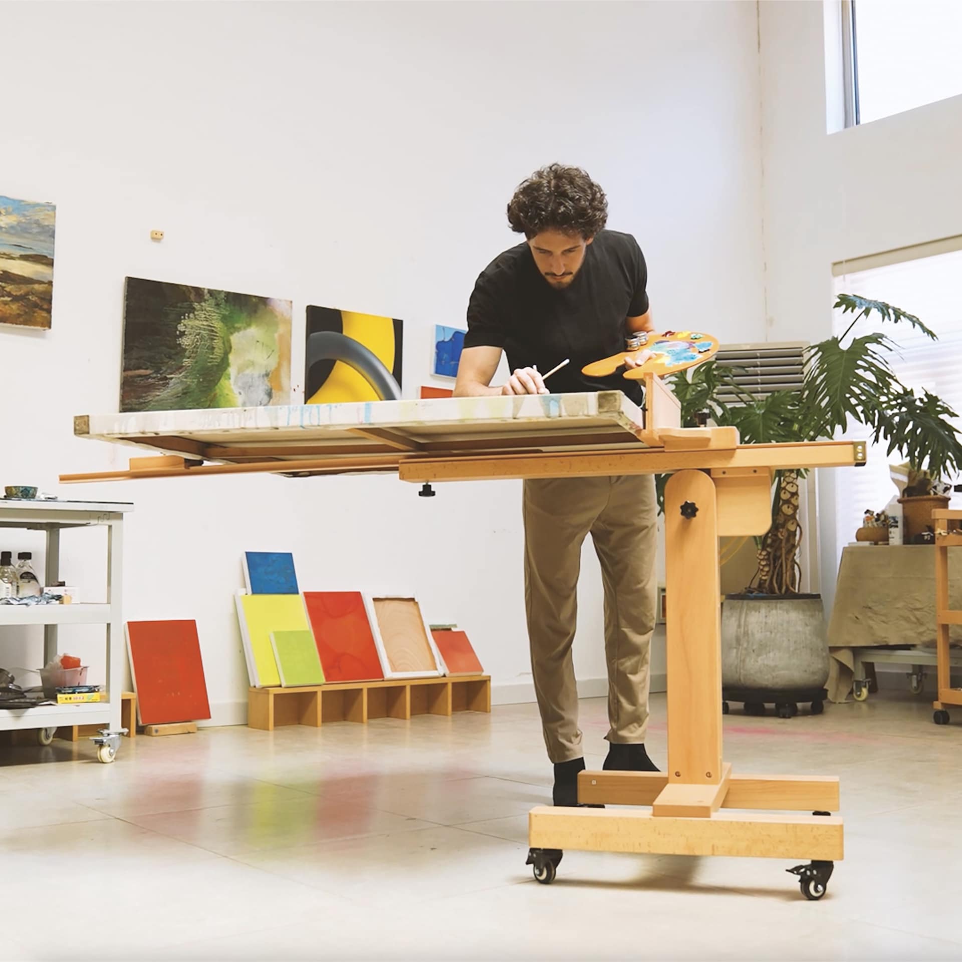 Meeden XL Adjustable Easel Stand - in use in studio, holding flat canvas