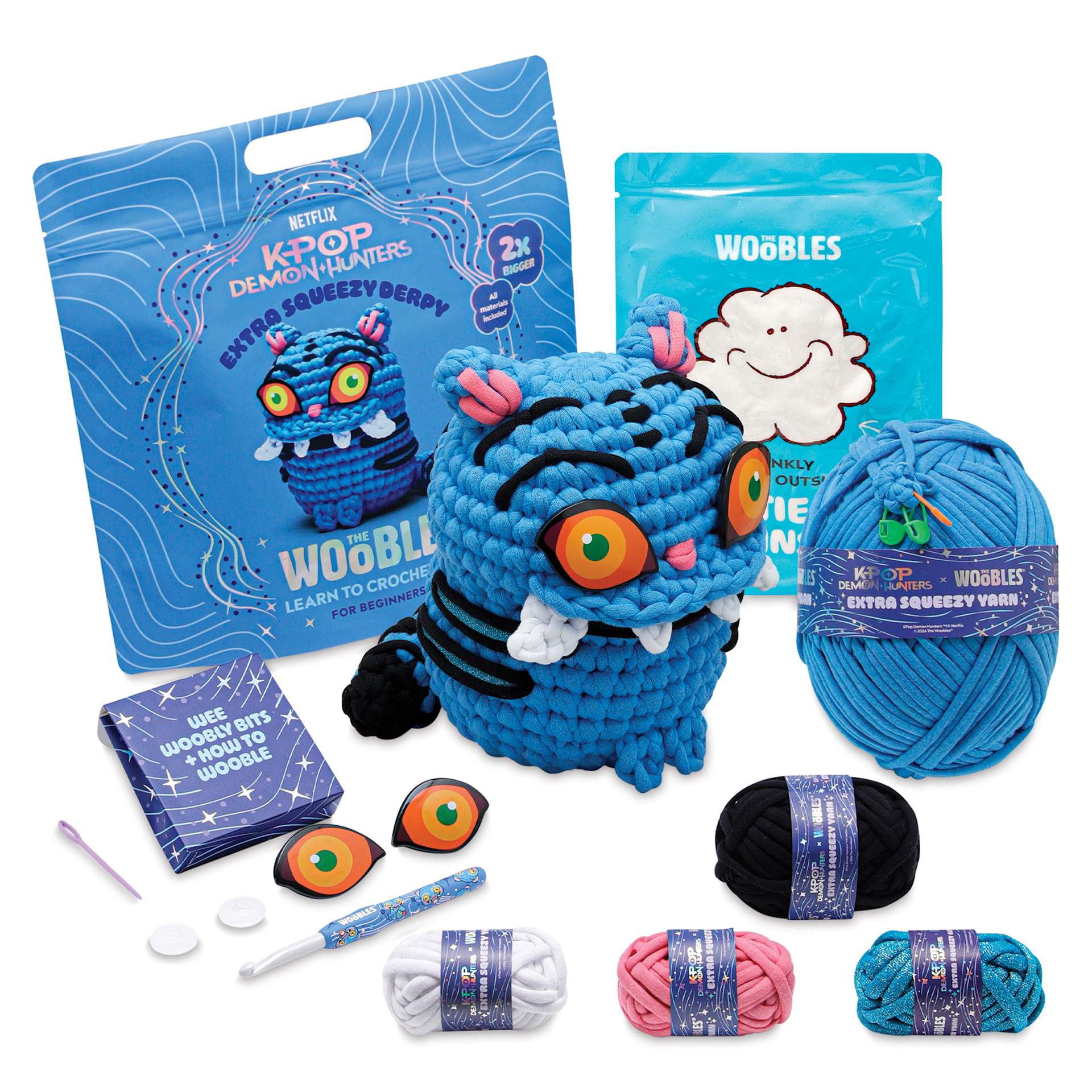 The Woobles Extra Squeezy Crochet Kit - Derpy the Tiger contents with completed project