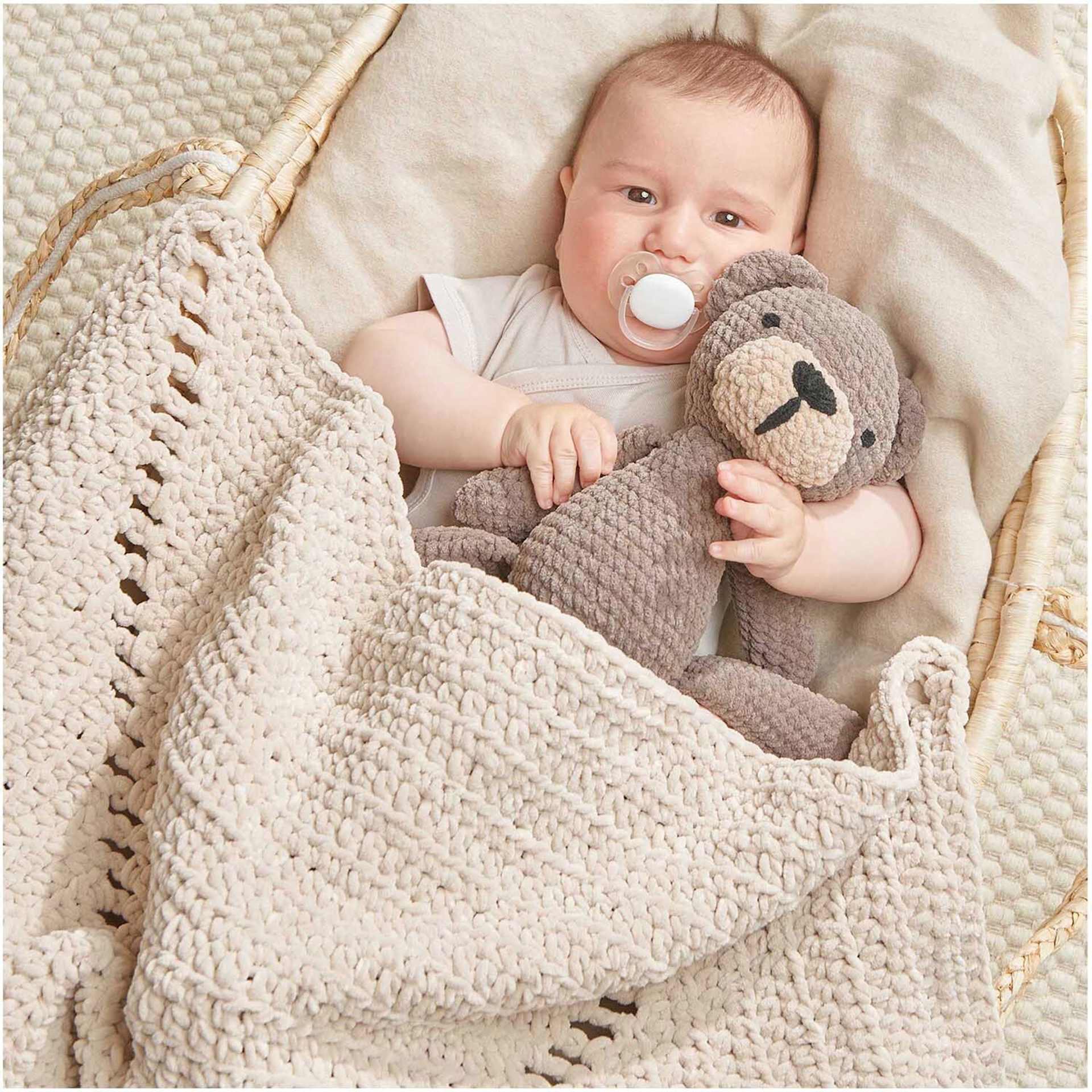 Rico Design Creative Chenillove Yarn - Ecru, 120 yds showing completed baby blanket project