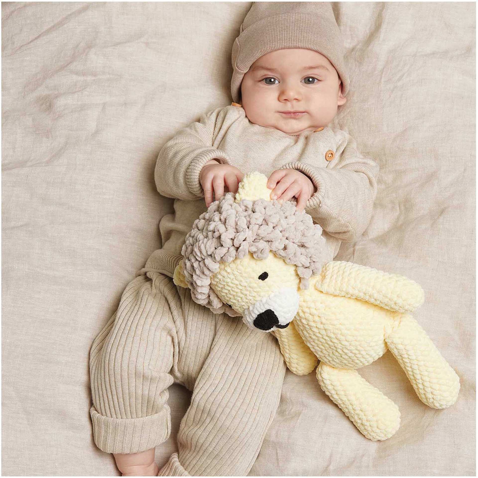 Rico Design Creative Chenillove Yarn - Ecru, 120 yds shoiwng completed baby clothes project