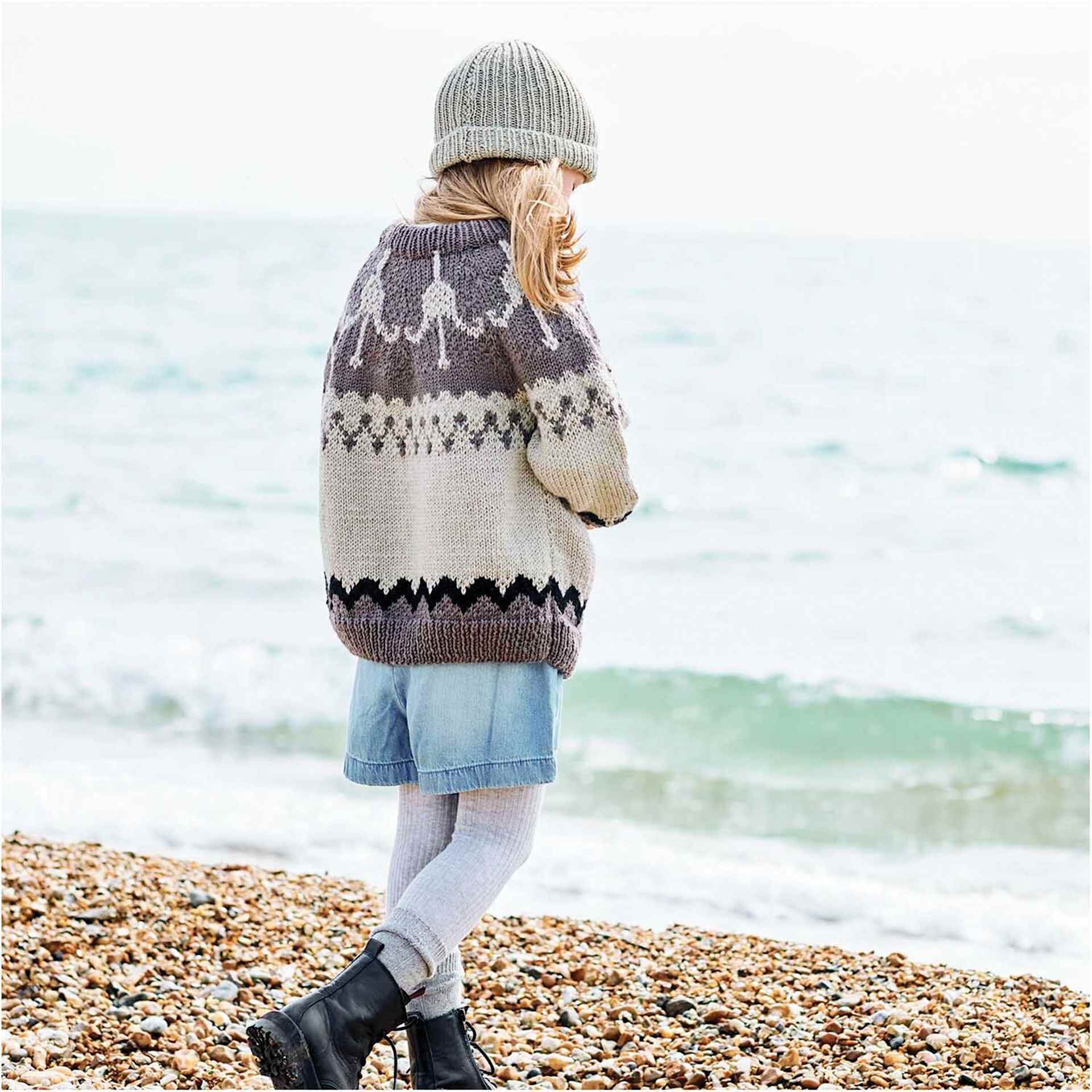 Rico Design Essentials Soft Merino Aran Yarn - Black, 109 yds shown in completed sweater project's design