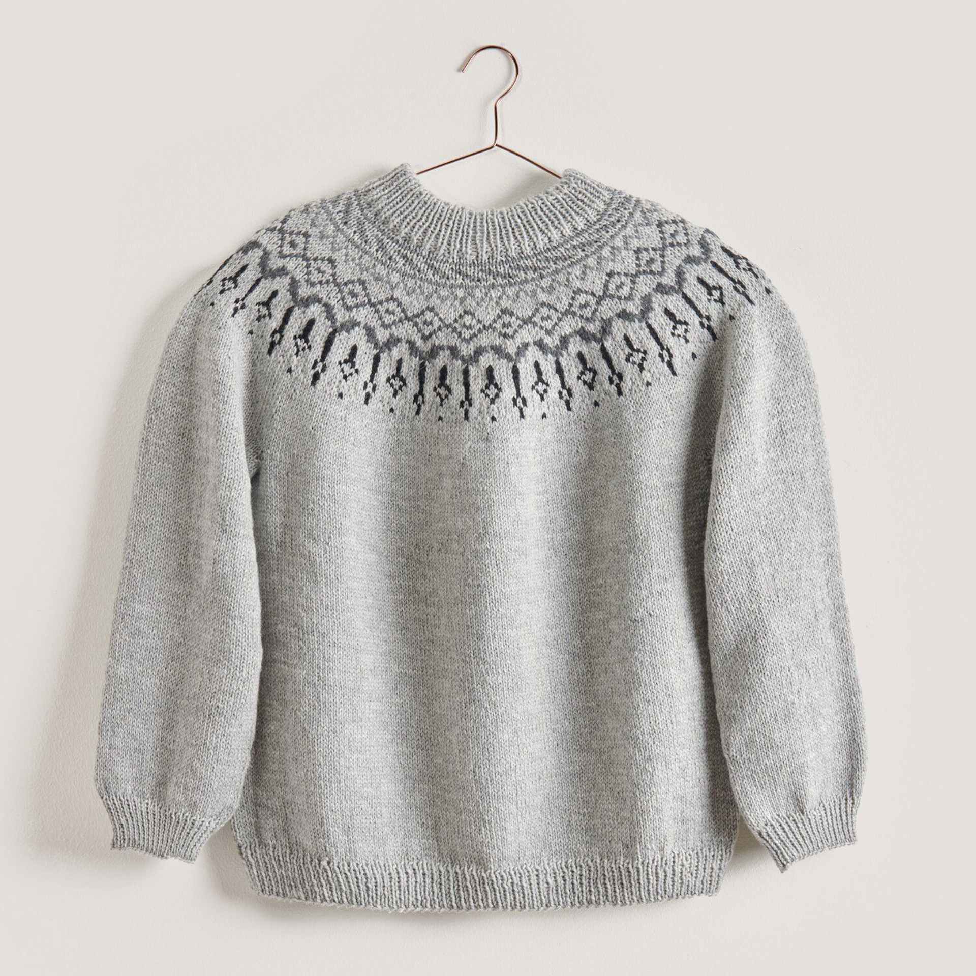 Rico Design Essentials Soft Merino Aran Yarn - Light Grey, 109 yds showing completed sweater project