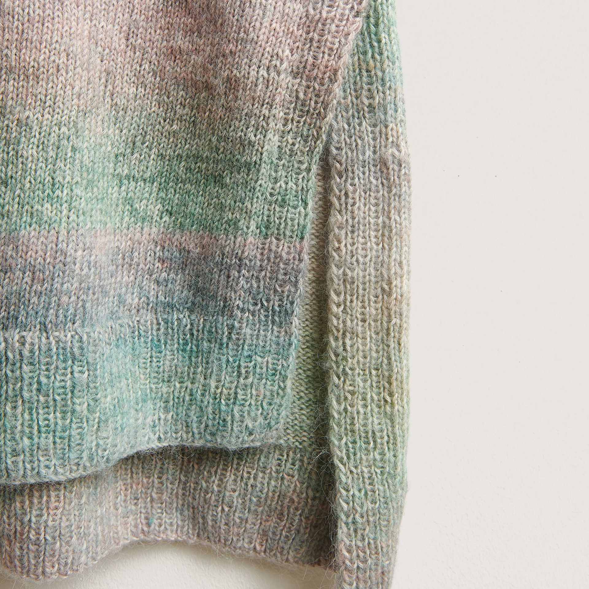 Rico Design Creative Painted Power Cotton DK Yarn - Earthy Rainbow. 100 g showing close up of completed shirt project's hem