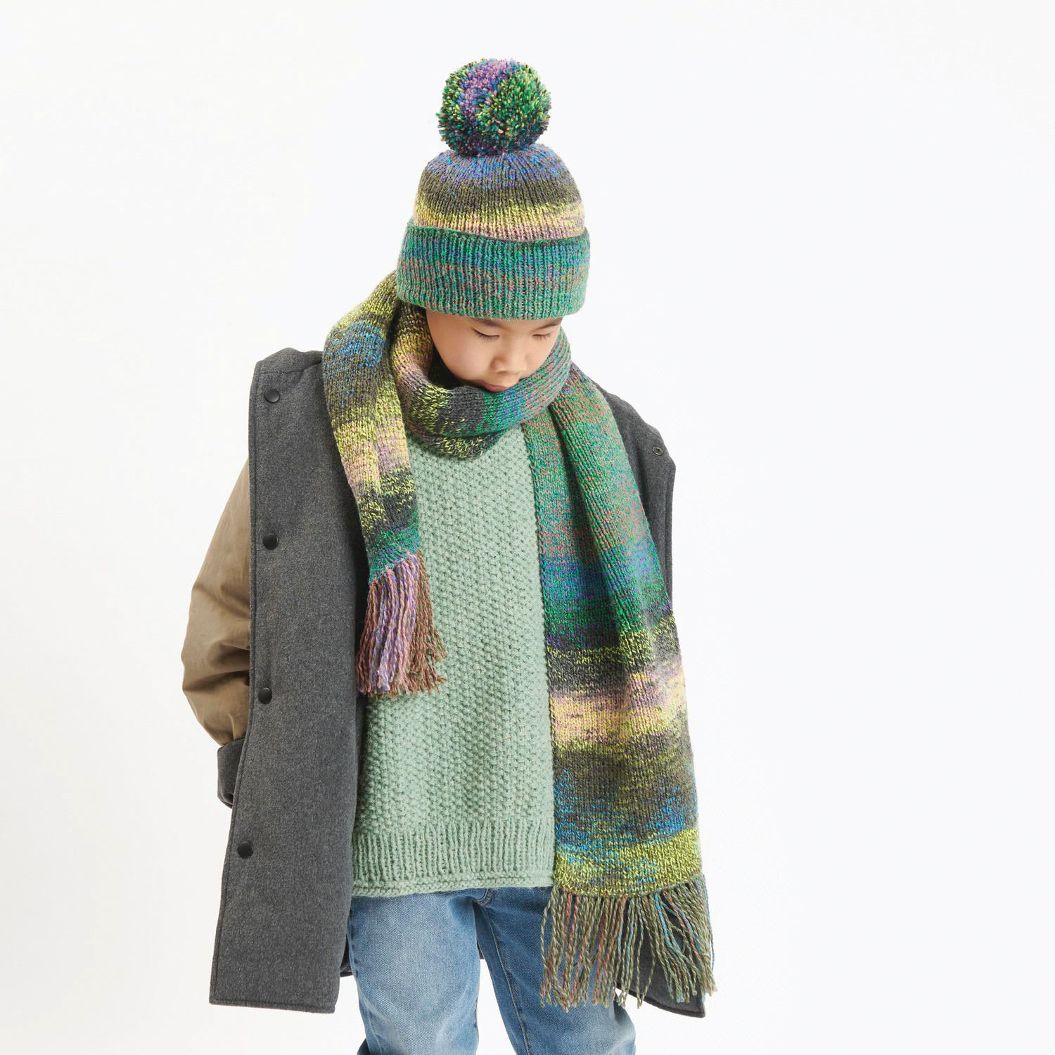 Rico Design Soft Alpaca Yarn - Aqua, 137 yds showing completed sweater project being worn
