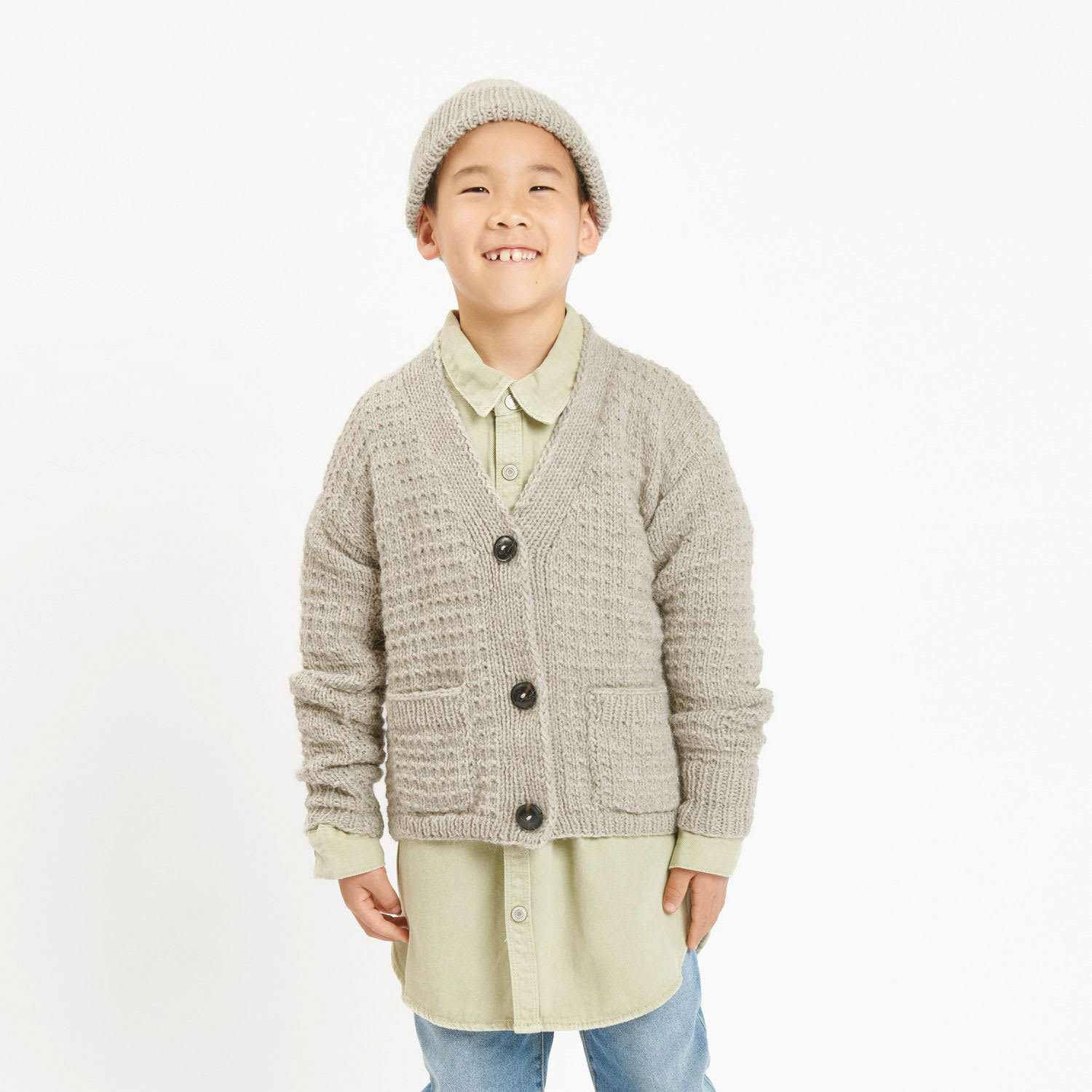 Rico Design Soft Alpaca Yarn - Beige, 137 yds showing completed cardigan project being worn