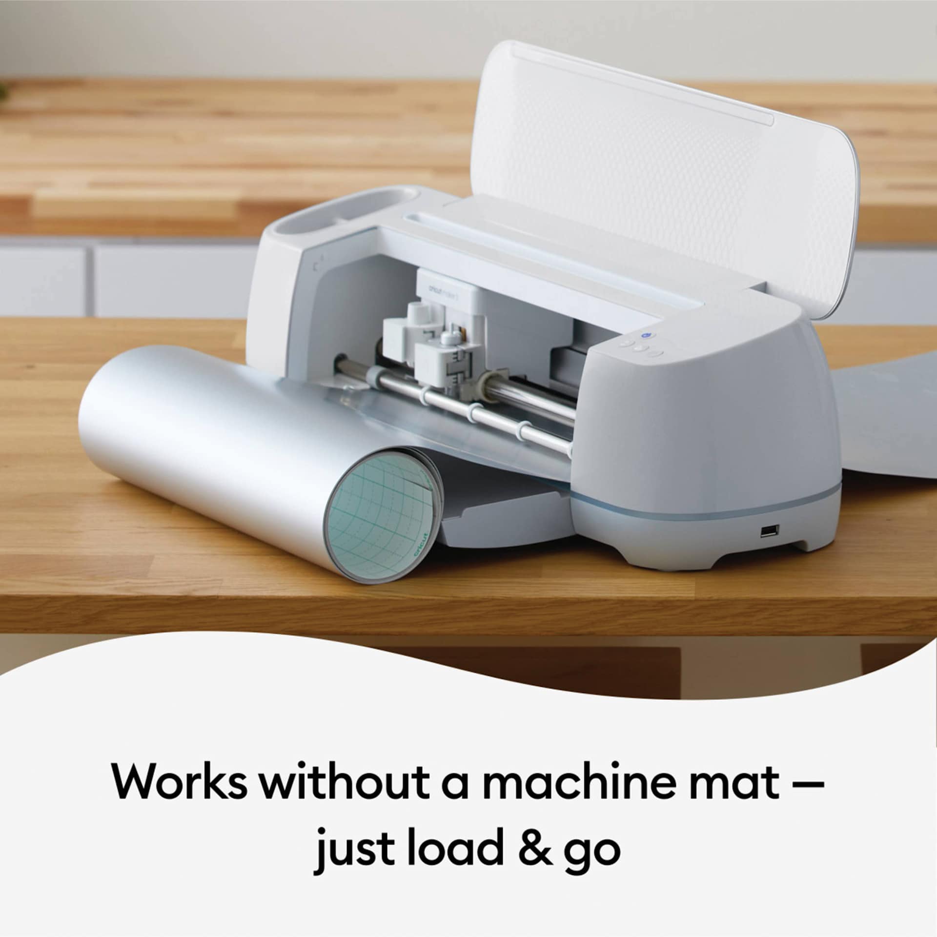 Cricut Removable Smart Vinyl - Metallic Silver, roll being loaded in machine (machine not included)