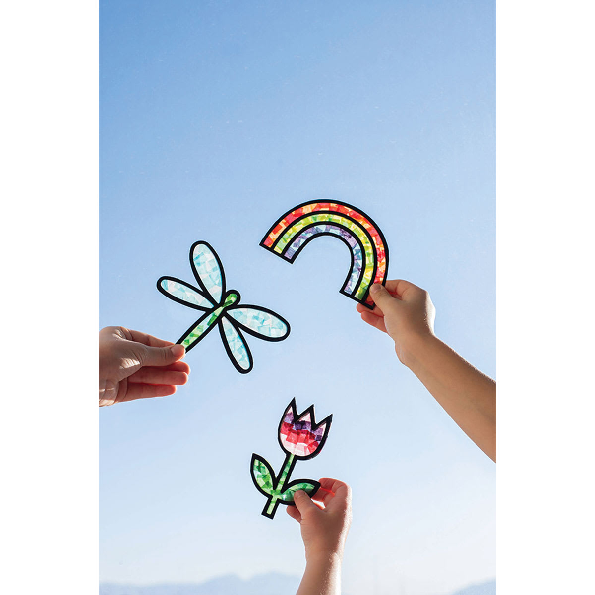 The Best Ideas For Kids Suncatchers Kit (Suncatchers being held up to sunlight)