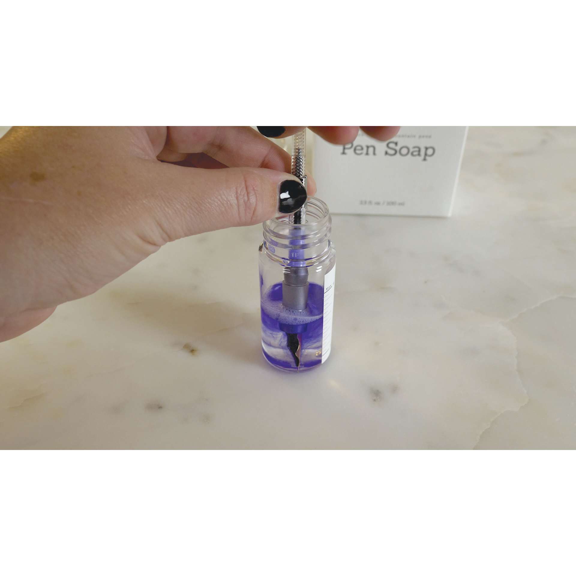 Colorverse Bath Time for Fountain Pens Pen Soap, pen submerged inside container filled with soap