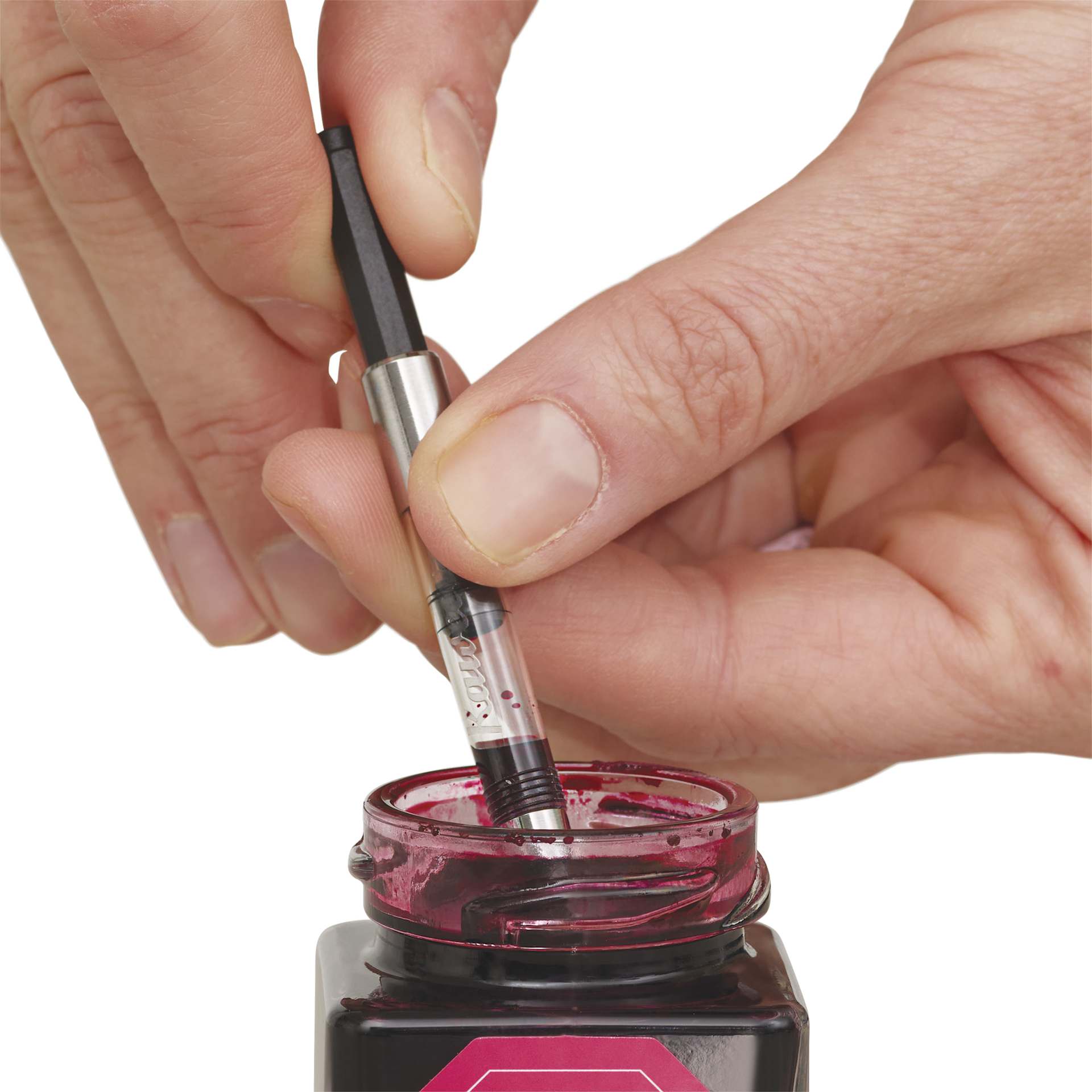Kaweco Standard Fountain Pen Ink Converter, converter in hand suctioning ink to reservoir