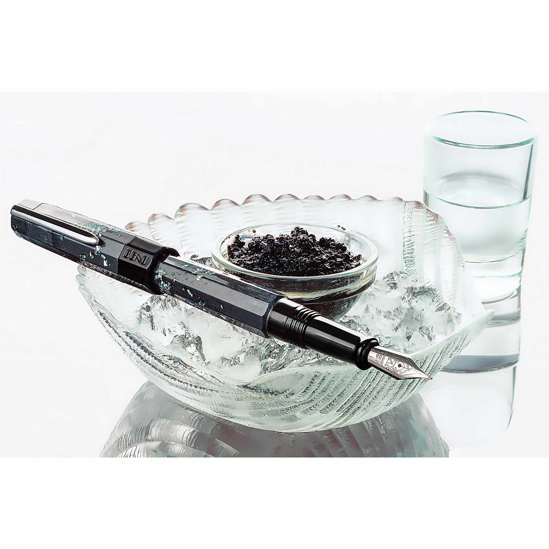 Benu Euphoria Fountain Pen - Caviar, pen laid out next to a tray full of caviar (image shows a different size nib)