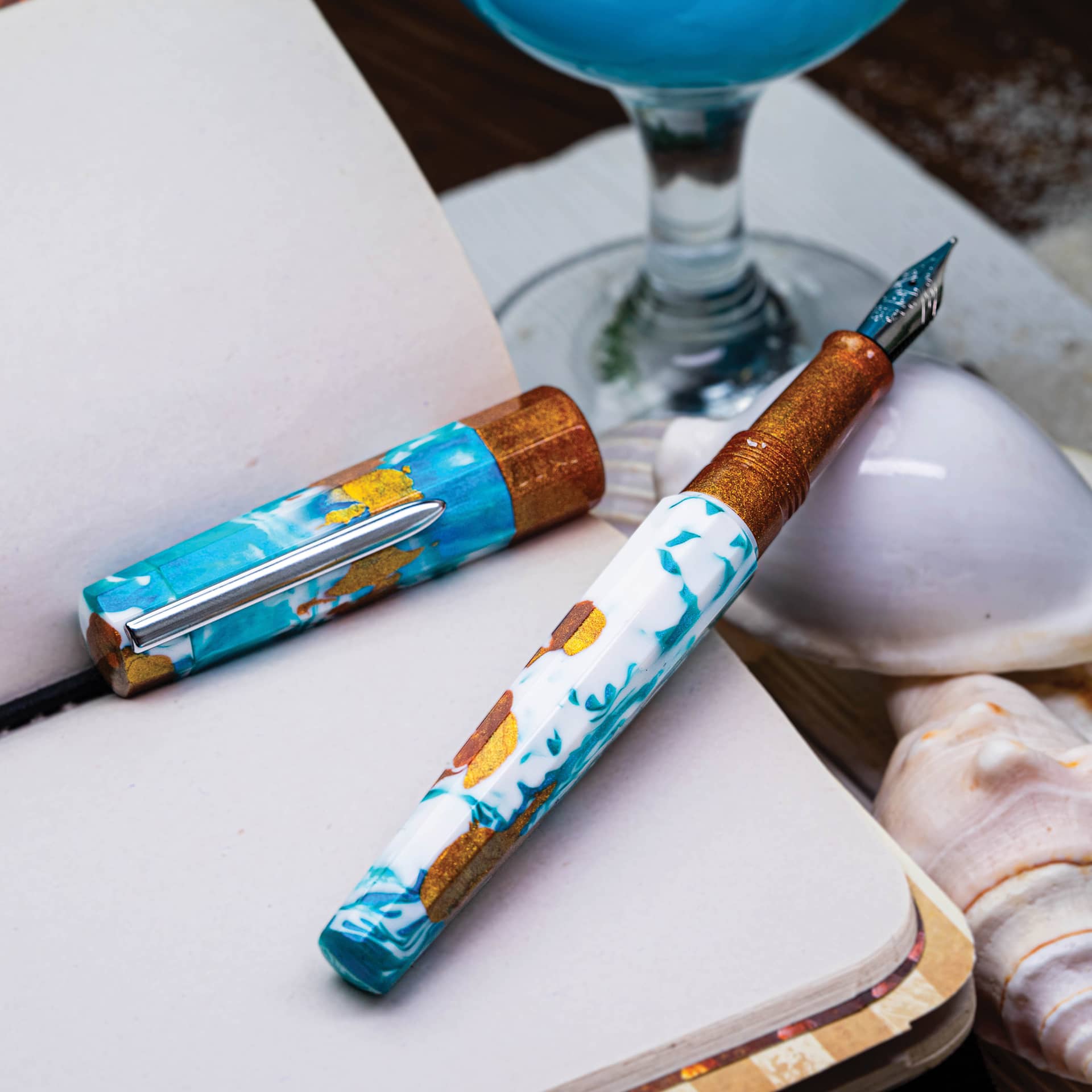 Benu Euphoria Fountain Pen - Blue Hawaiian, pen laid out with cap removed (image shows a different size nib)