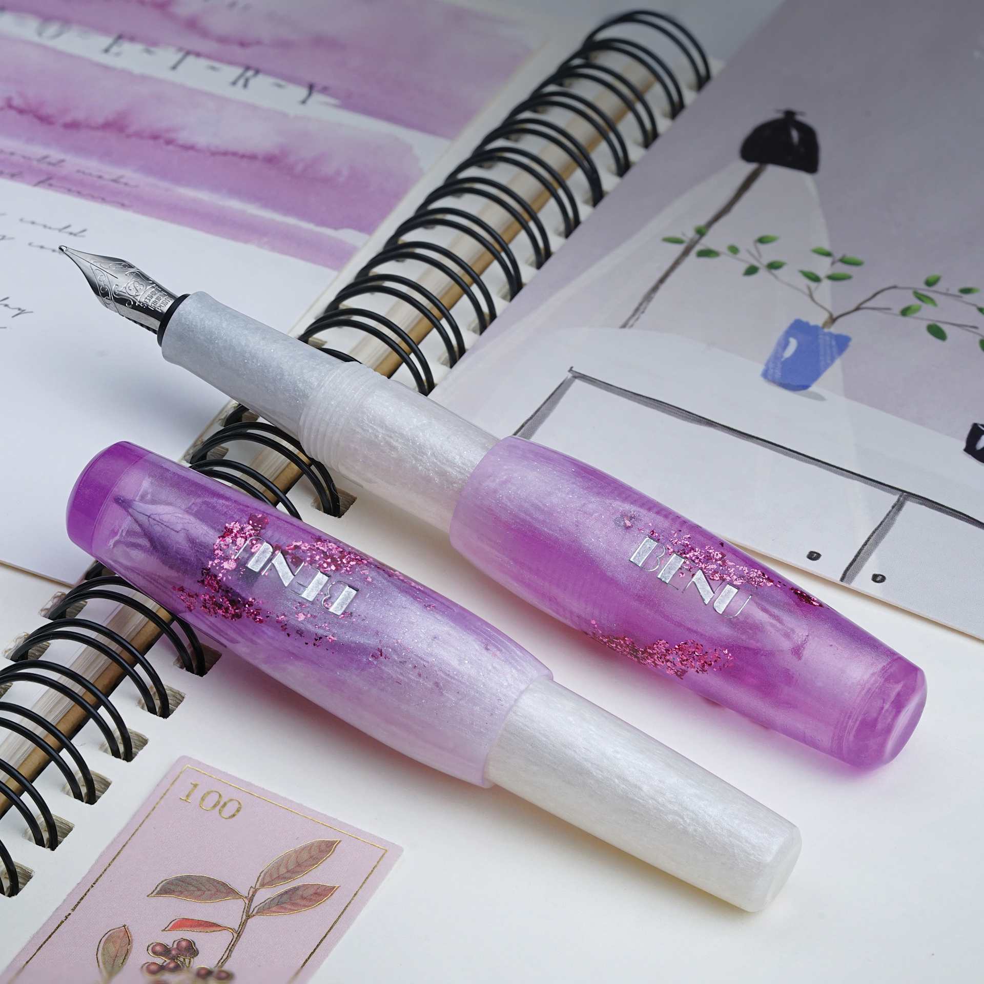 Benu Pixie Fountain Pen - Icy Violet, two pens laid out (image may show a different size nib)
