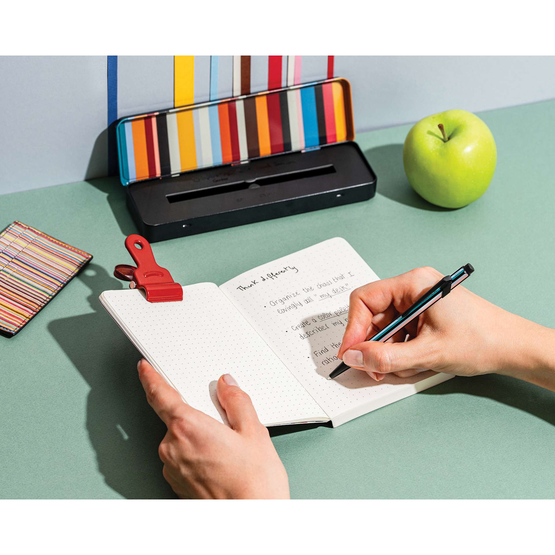 Caran d'Ache Special Edition No. 5 Paul Smith 849 Ballpoint Pen - Black, writing in notebook