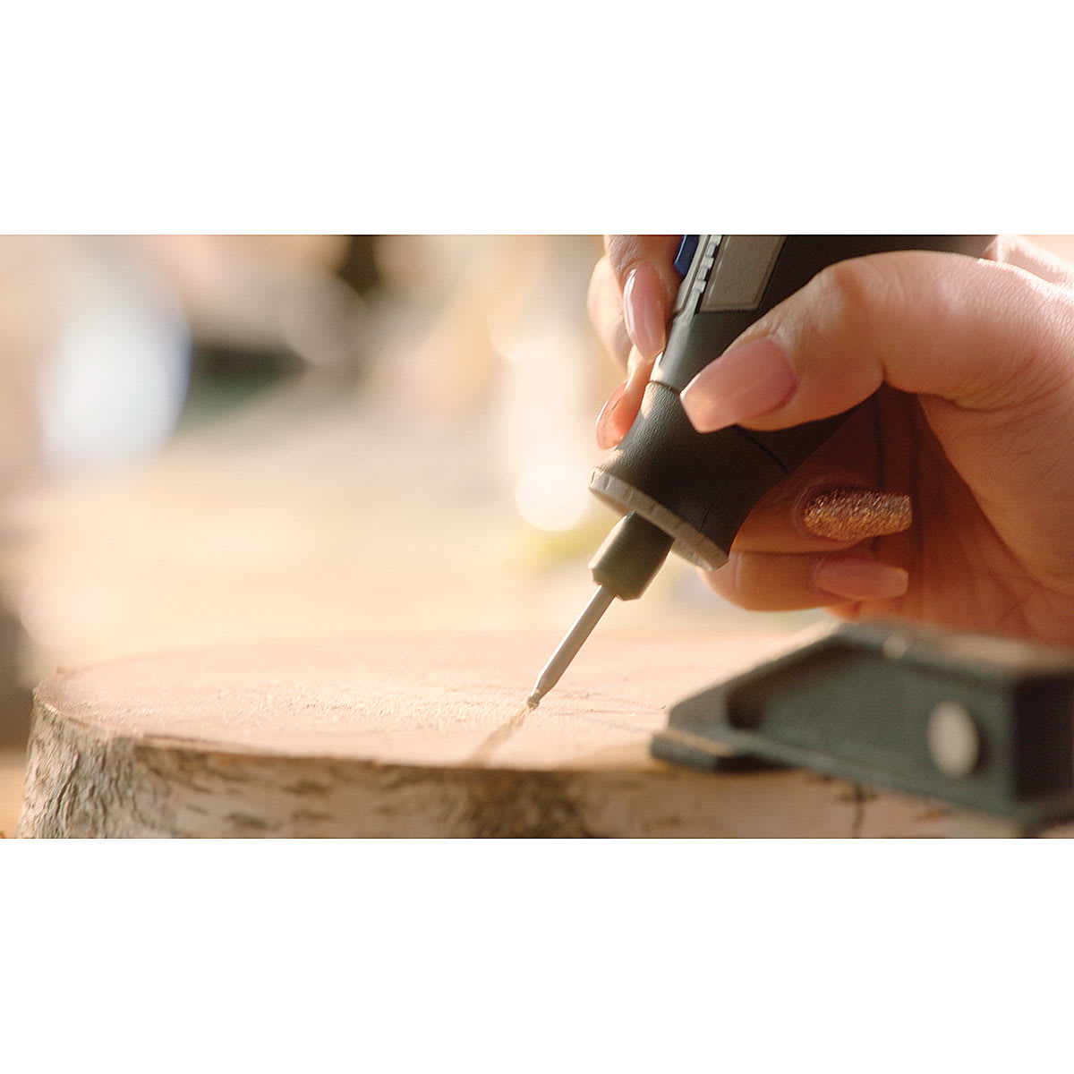 Dremel Wood Accessory Kit - Hand using Tool to engrave wood with accessory