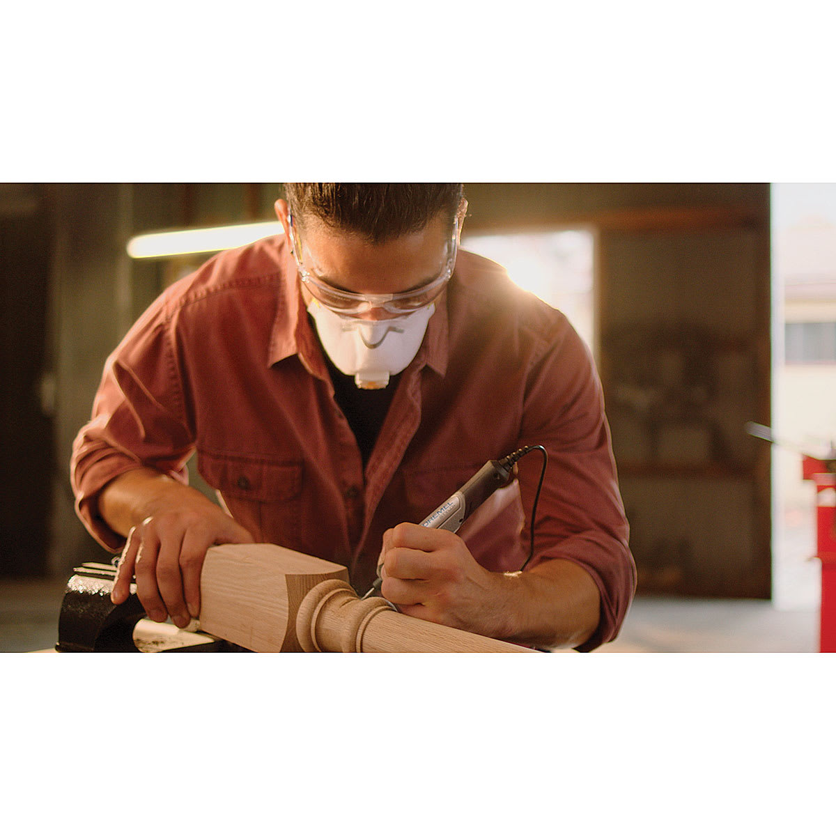 Dremel Wood Accessory Kit - Man using tool and accessory to touch up post